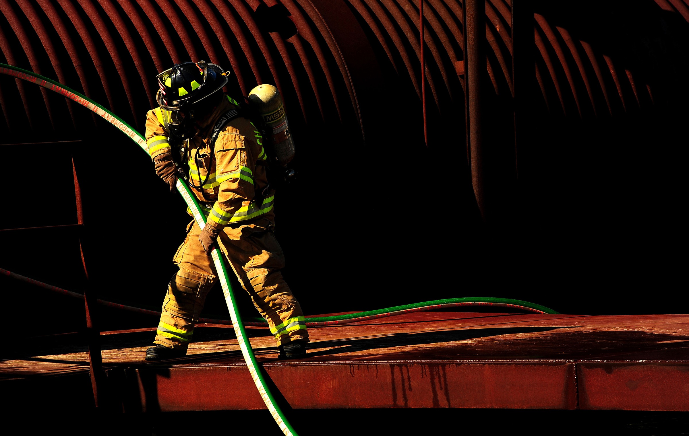 Firefighter with the waterpipe photo