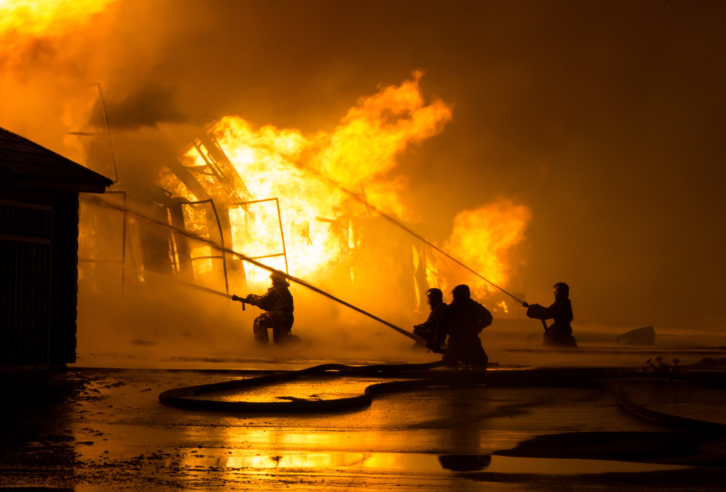 Firemen at work on fire –