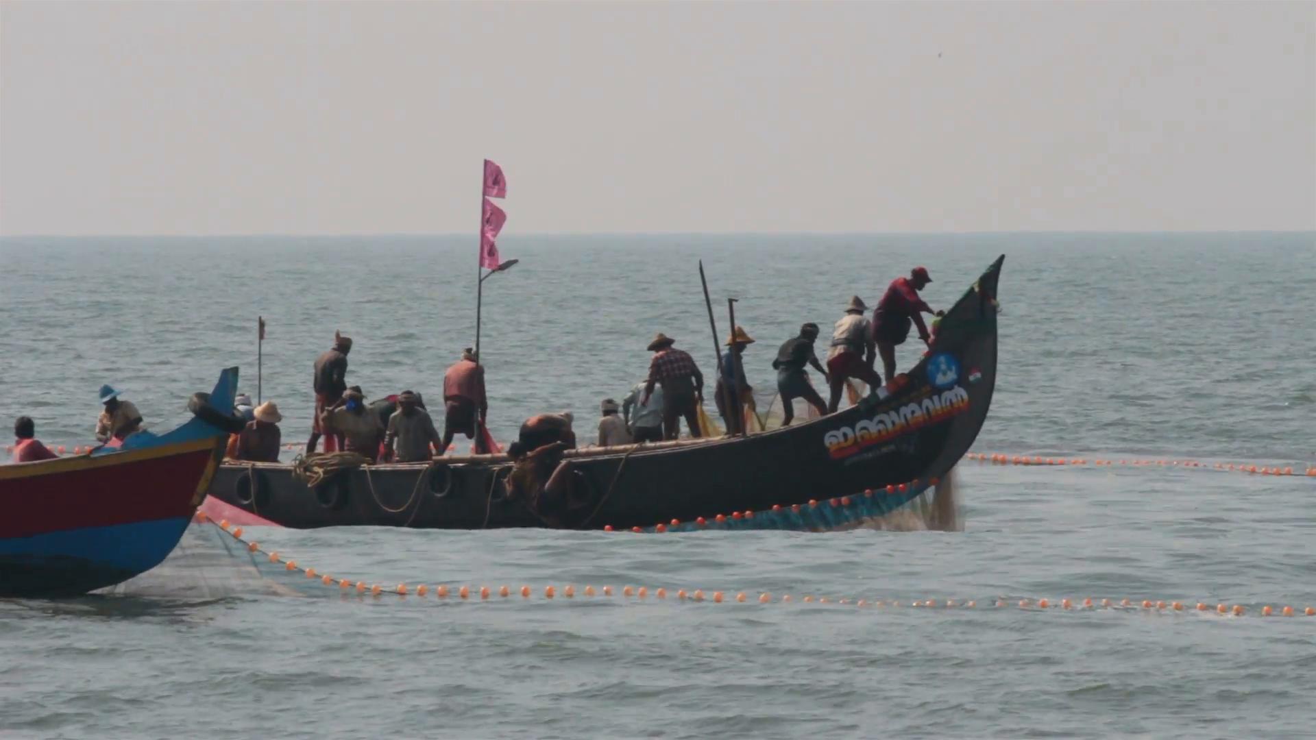 fishermen in boats pulling fishing nets - Kerala India Stock Video ...
