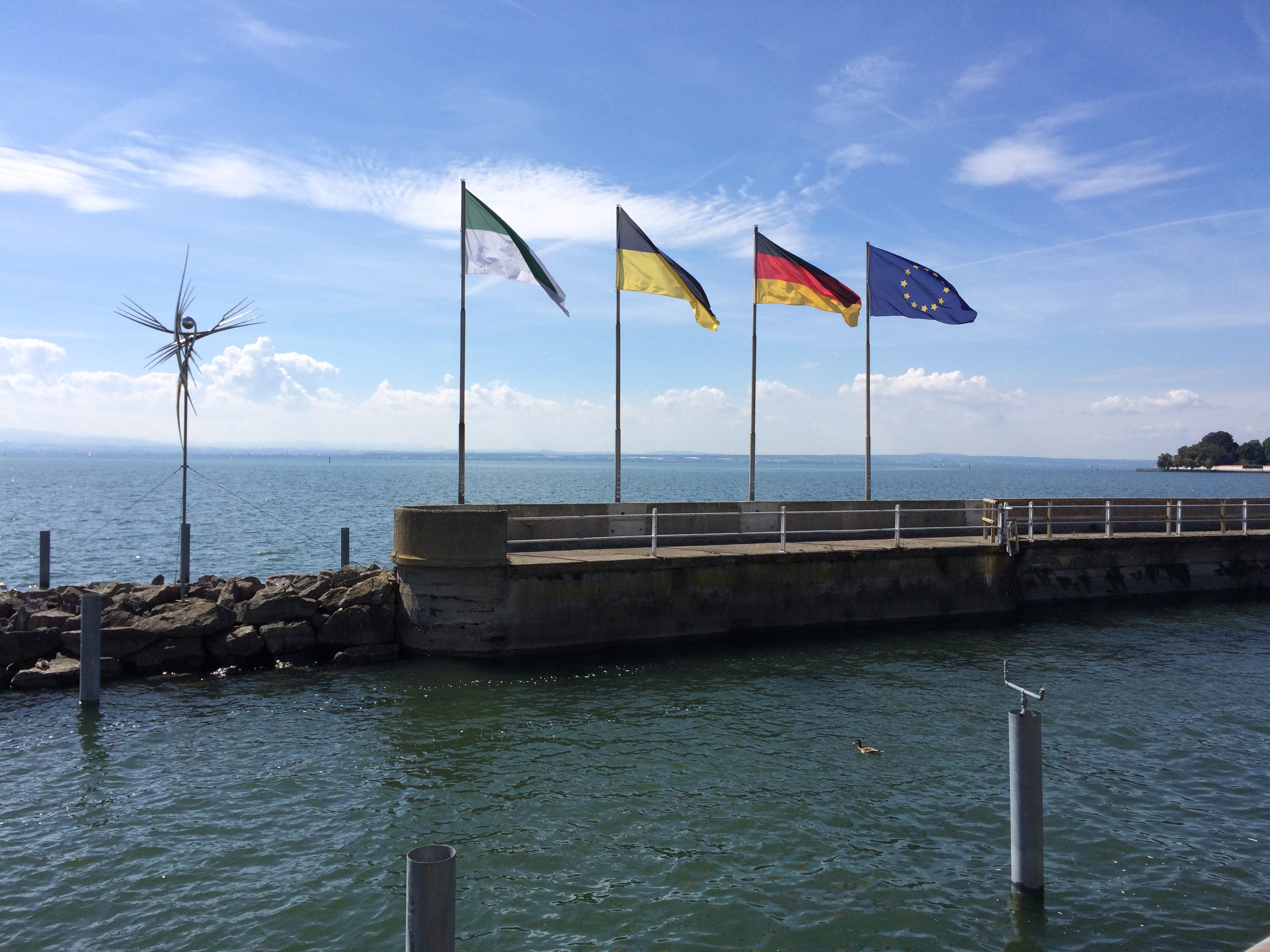 Flags flying over the bodensee, friedrichshafen, germany photo