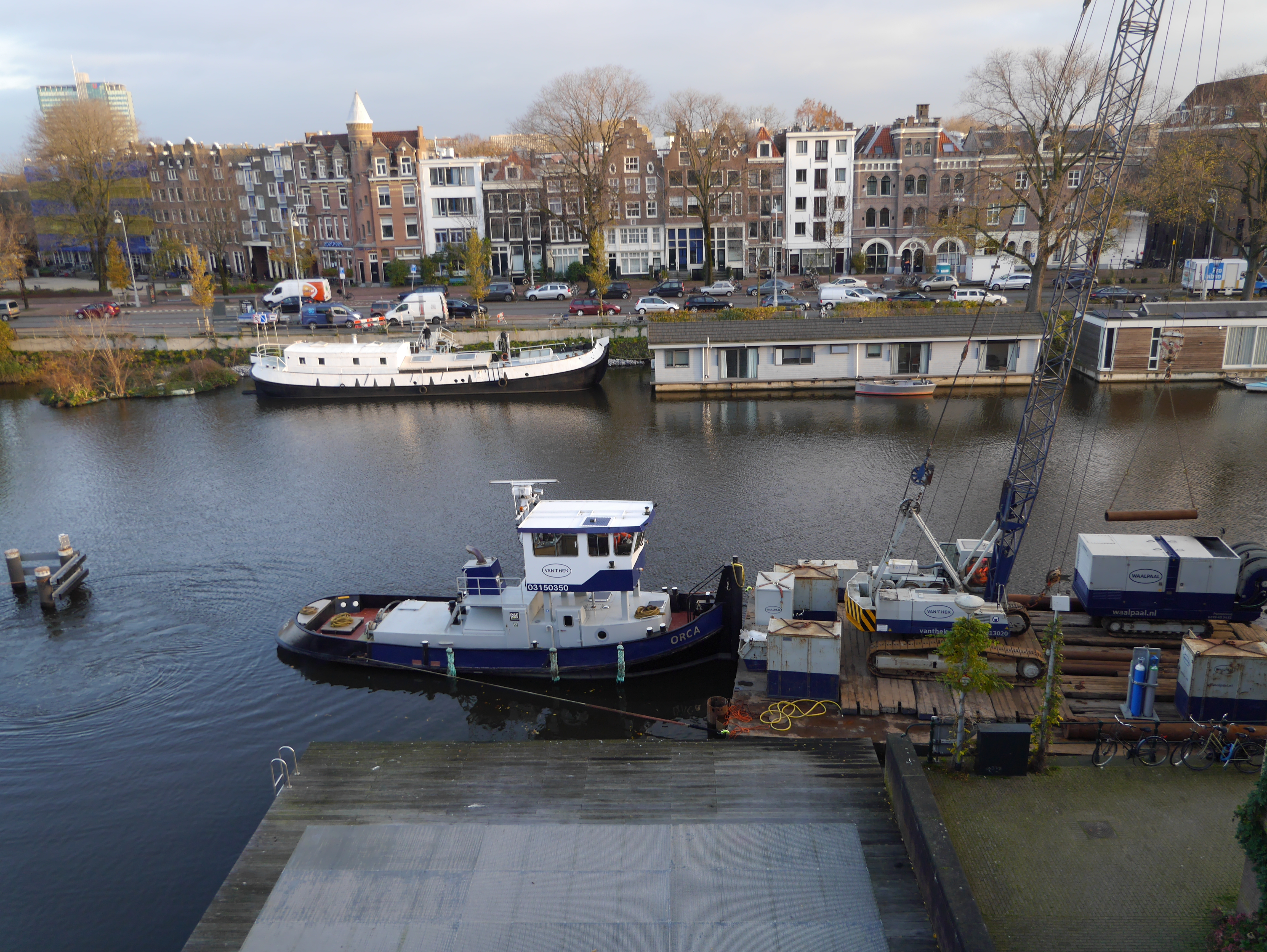 floating crane in the canal with other construction boats, Amsterdam, floating crane in the canal with other construction boats, Amsterdam