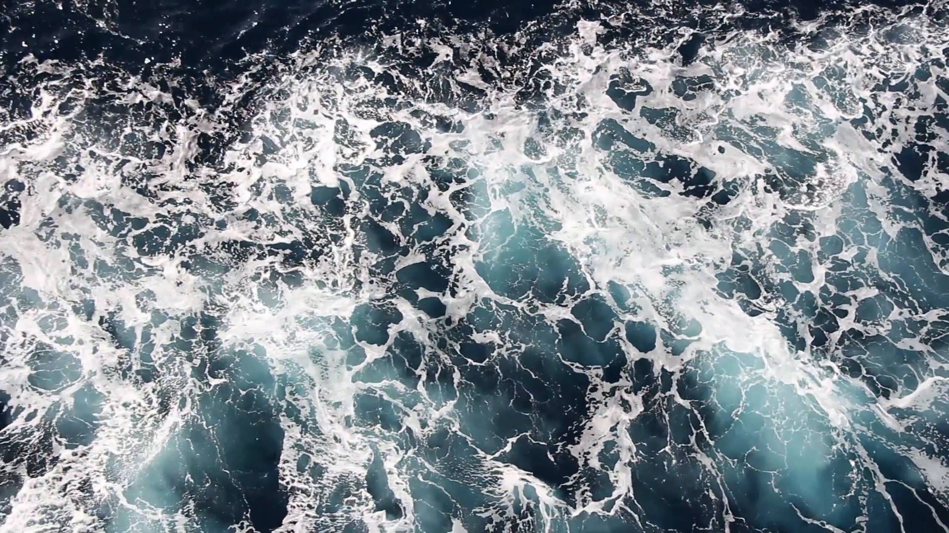 Seawater with sea foam behind a boat as background, full HD video ...