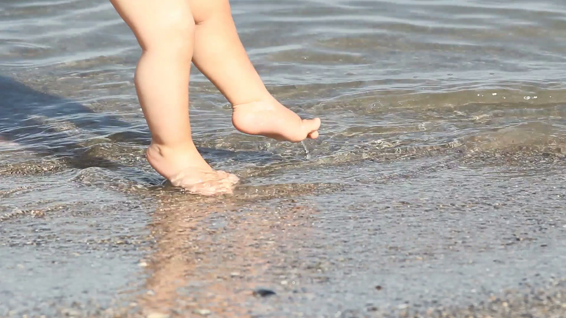 Baby feet in water sea Stock Video Footage - Videoblocks