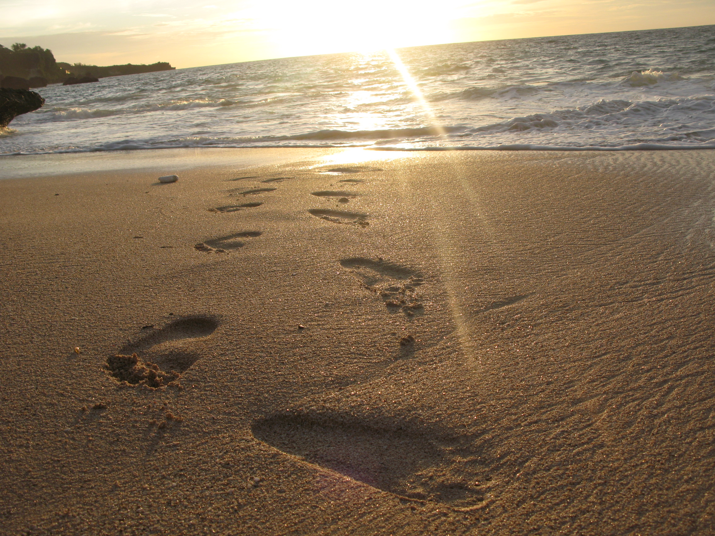 Footprints at coastal sand photo