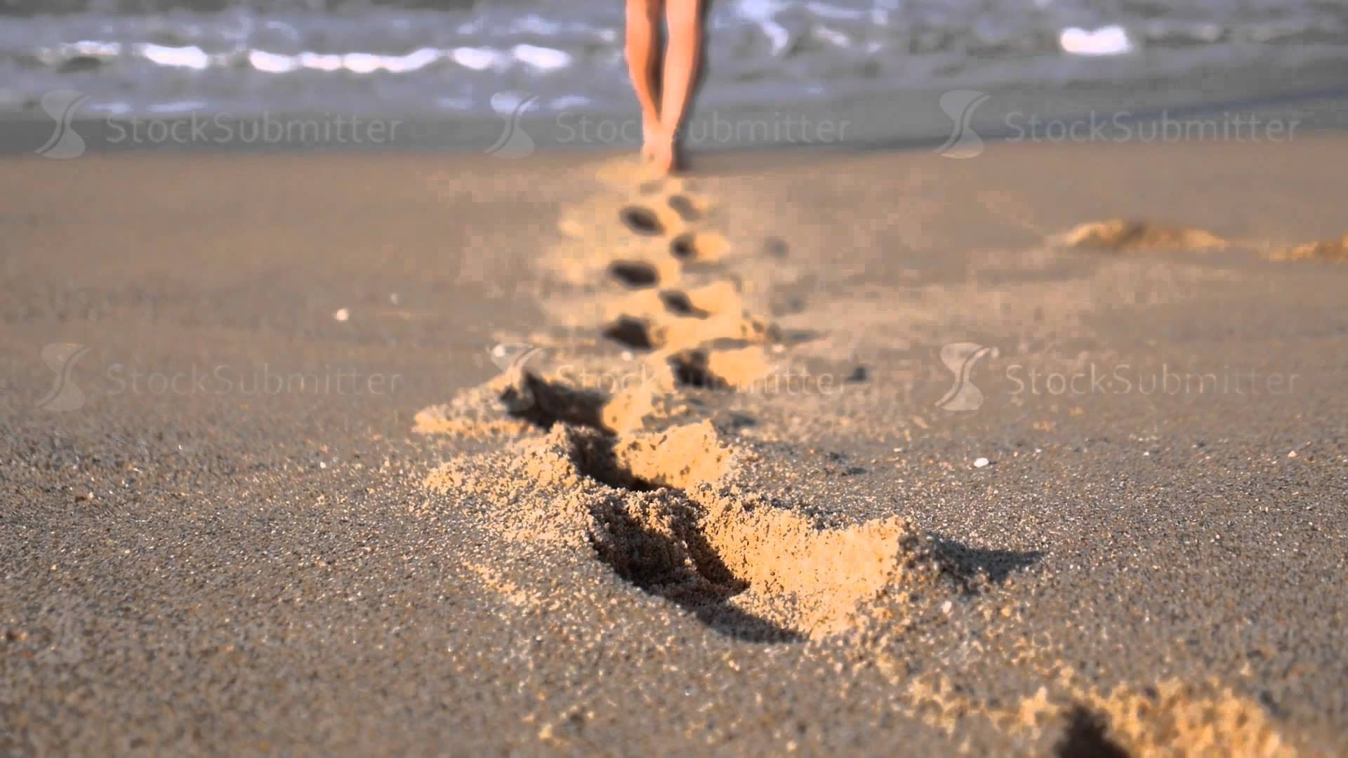 Female Feet Leaving Footprints in Sand Walking on Beach - YouTube