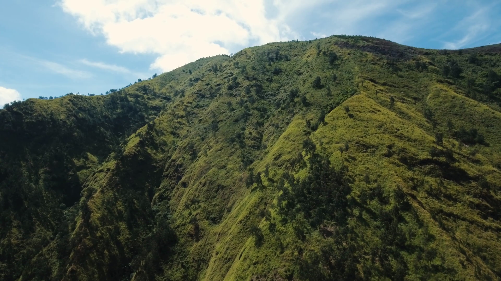 Aerial view Slopes of mountains covered with green tropical forest ...