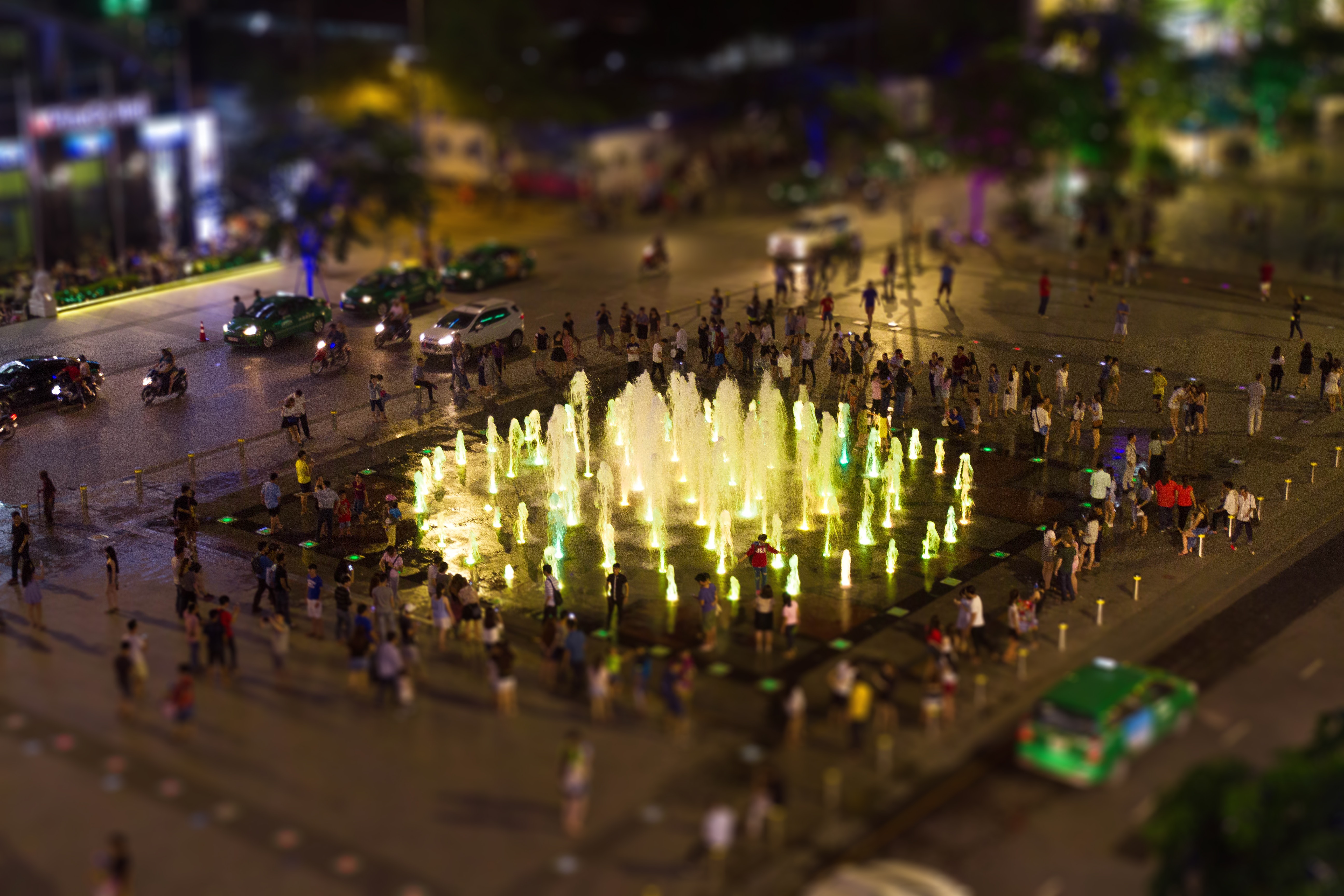 Fountain surrounded by people during nighttime photo