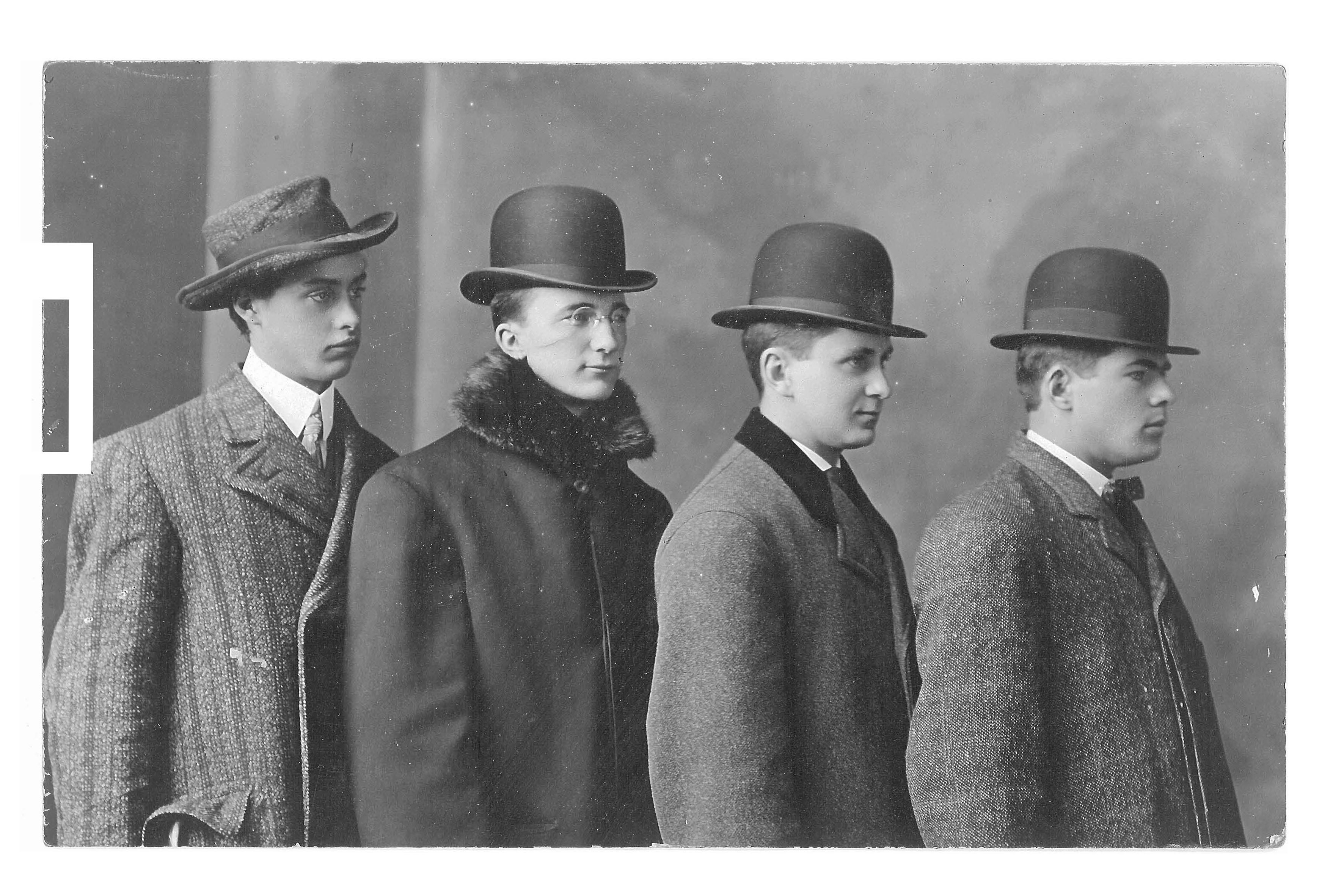 Thoughts on a photograph of four men wearing hats