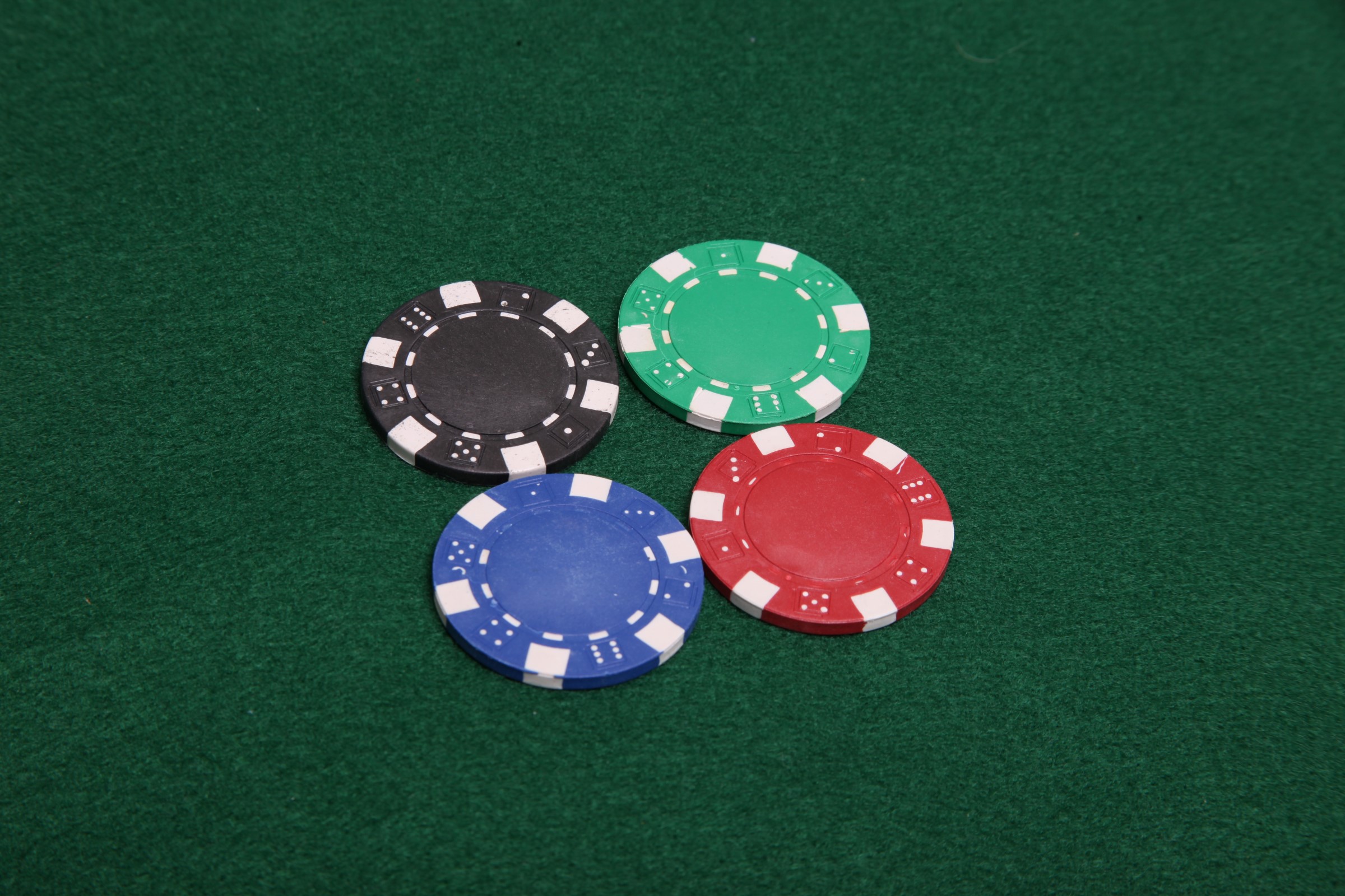 Four poker chips photo