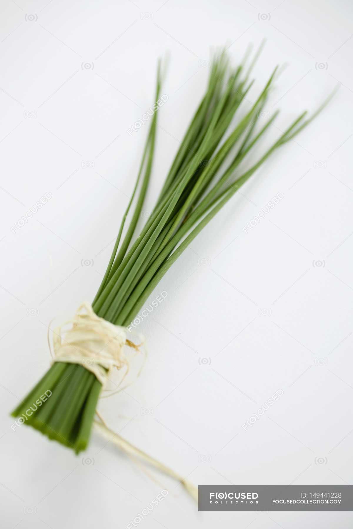 Fresh chives tied with rope — Stock Photo | #149441228