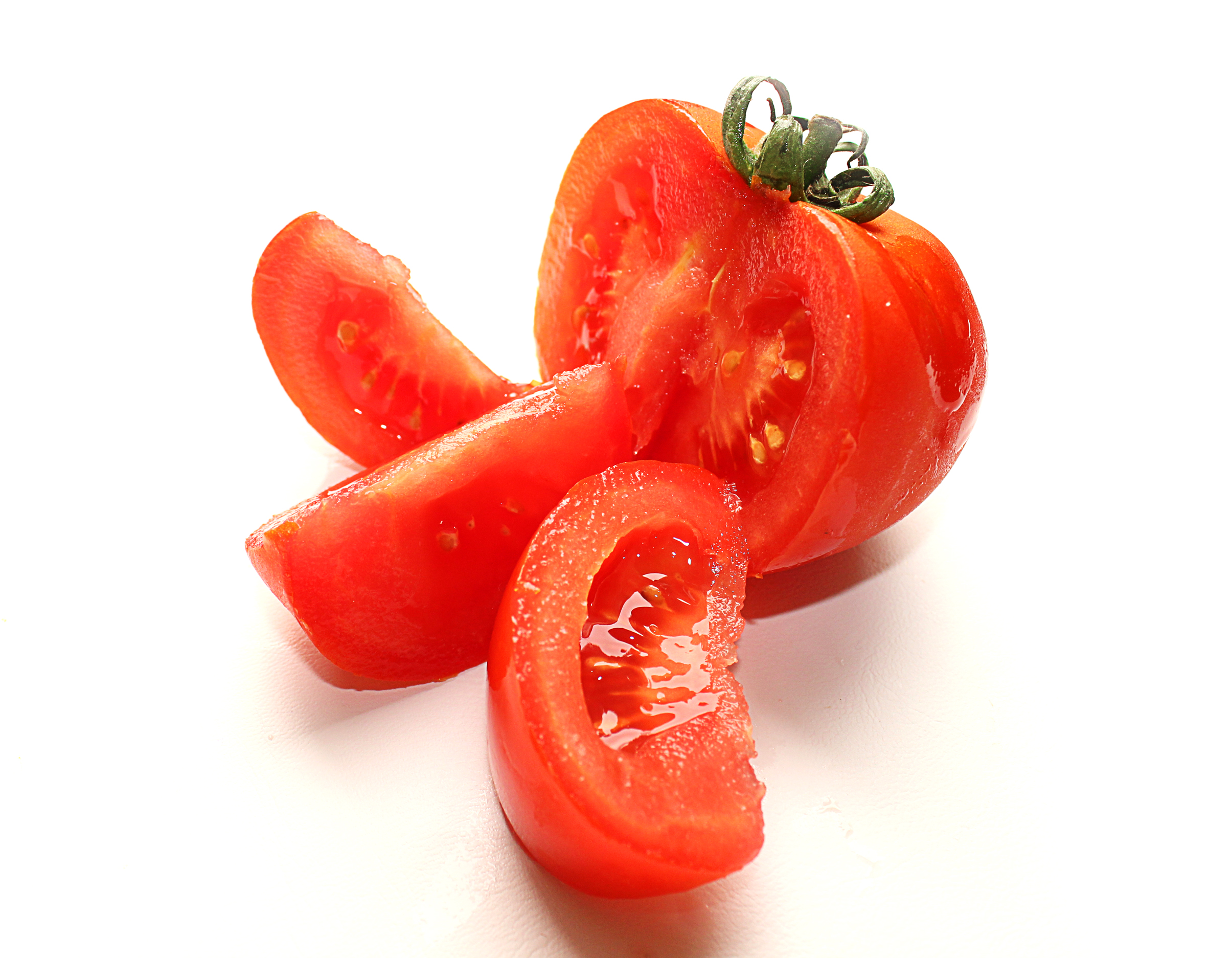 Fresh sliced tomato isolated on white photo
