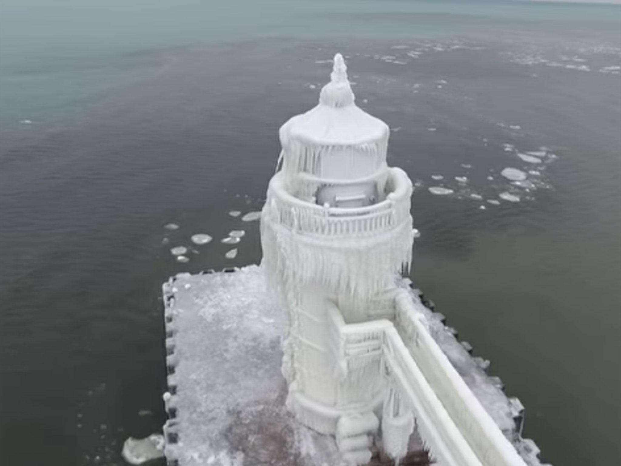 Stunning footage captures frozen lighthouse on Lake Michigan as ...