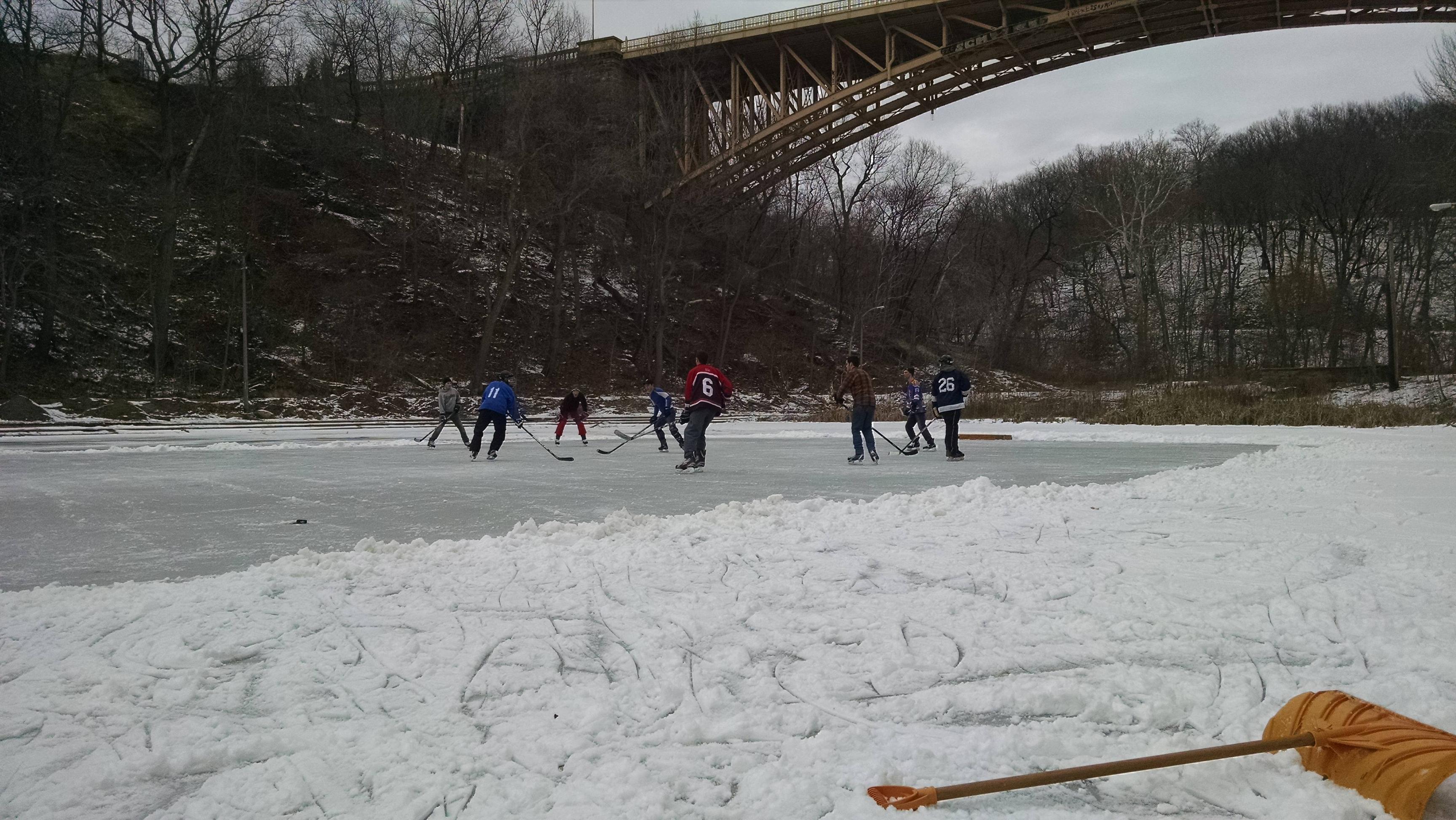 Some friends playing hockey at a frozen pond in Pittsburgh. : hockey