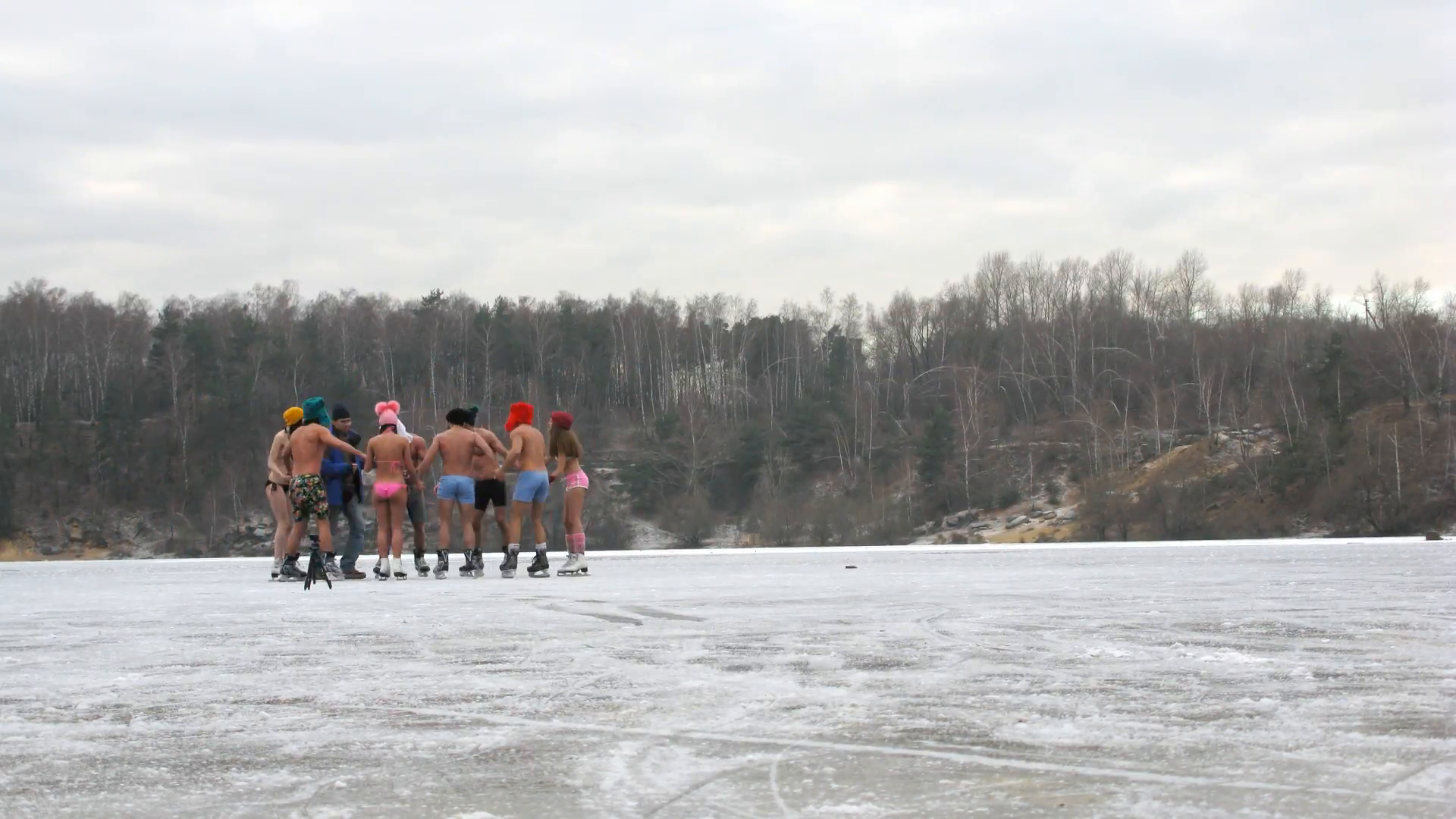 Shoot video of cheerful boys and girls in bathing suits, skating on ...