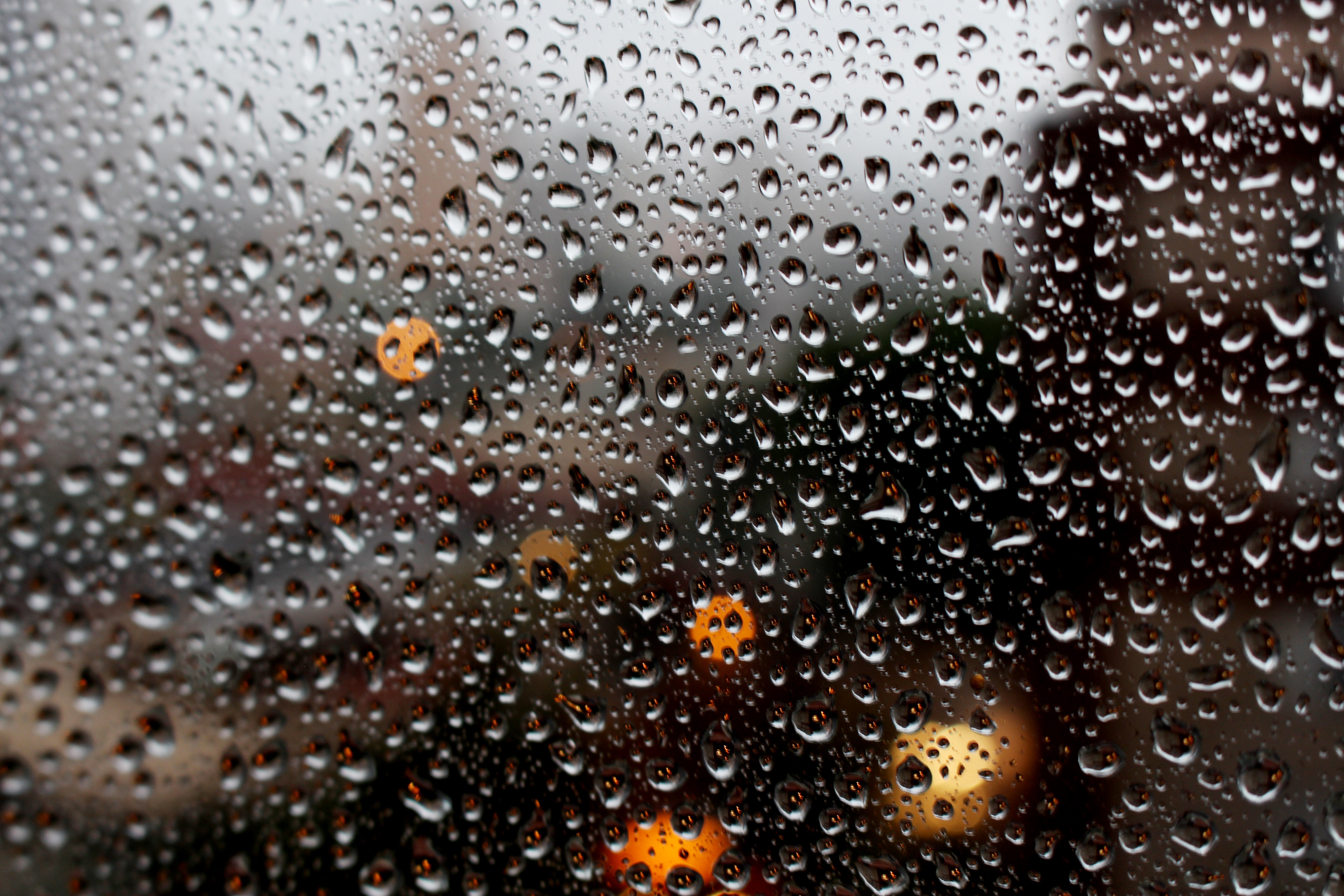 Full frame shot of raindrops on glass window photo