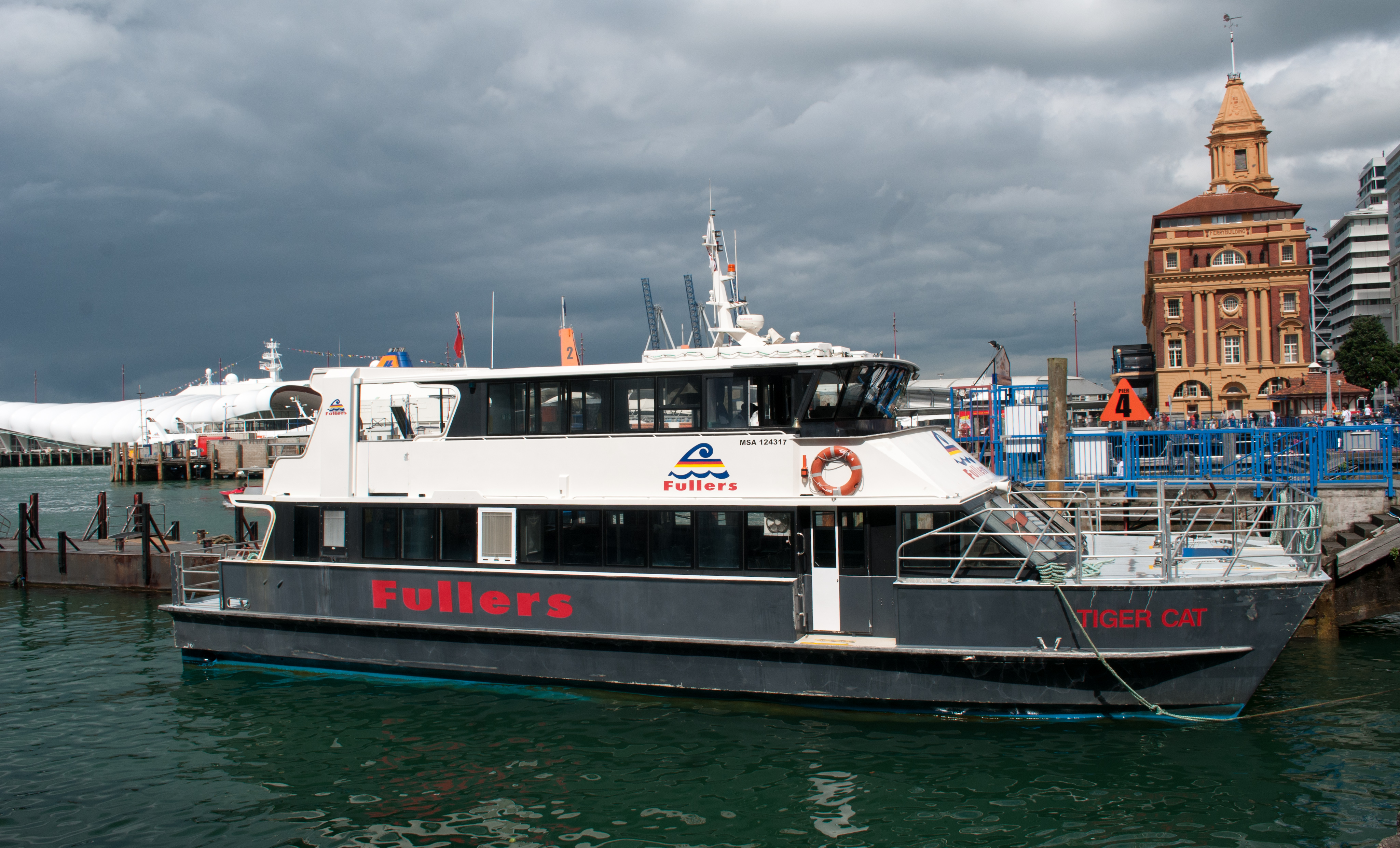 Fullers tiger cat ferry in front of auckland ferry terminal photo