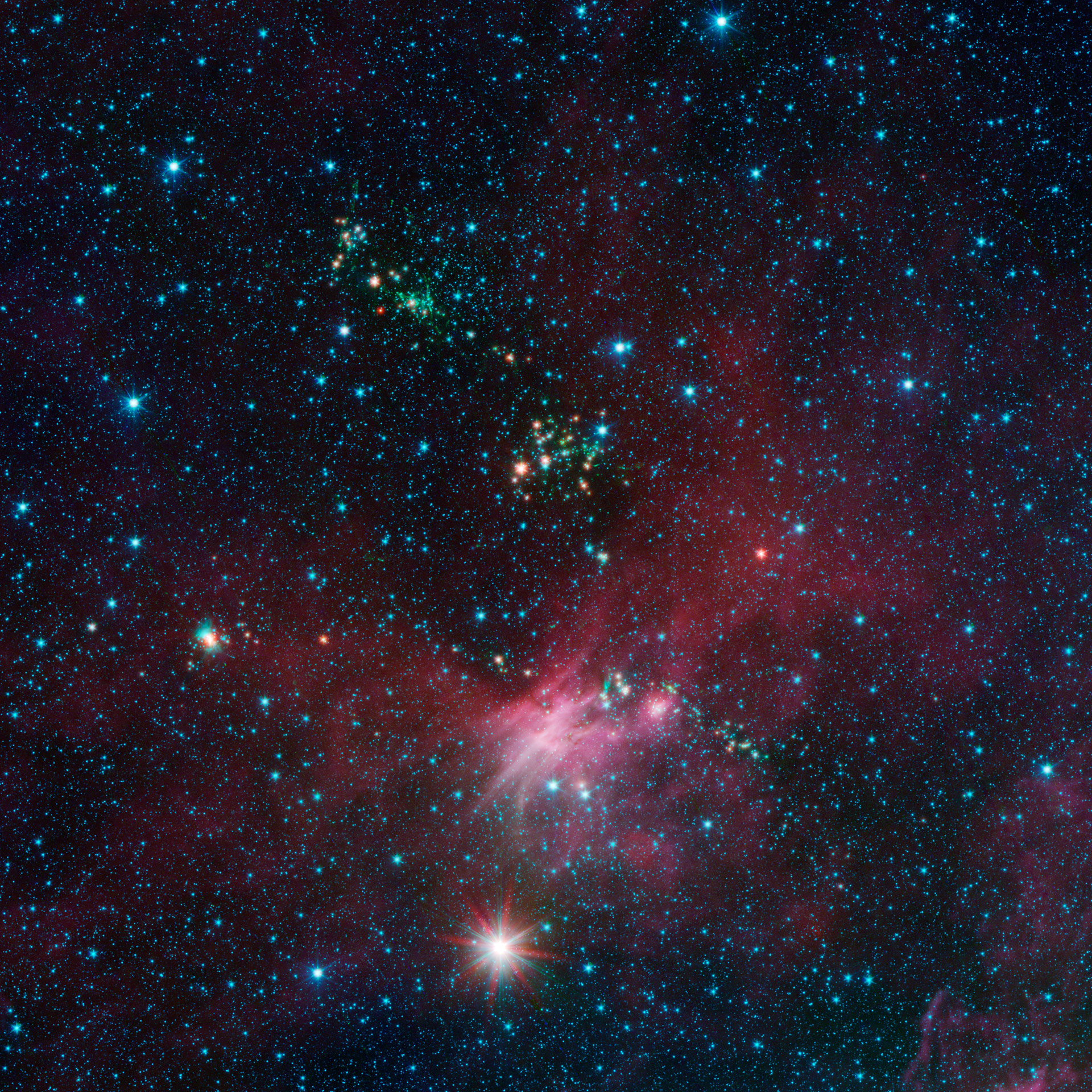 Spitzer Views Birth and Death of Stars at the Outer Edges of the Galaxy