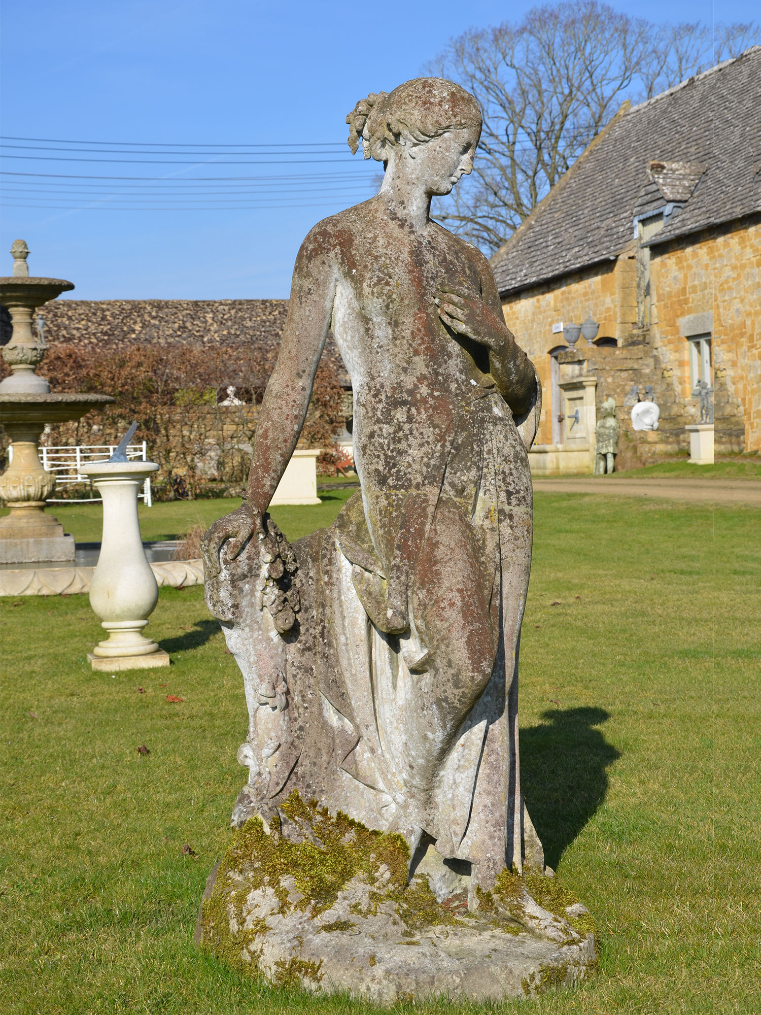 A 19th Century composition stone garden figure of Flora by Austin ...
