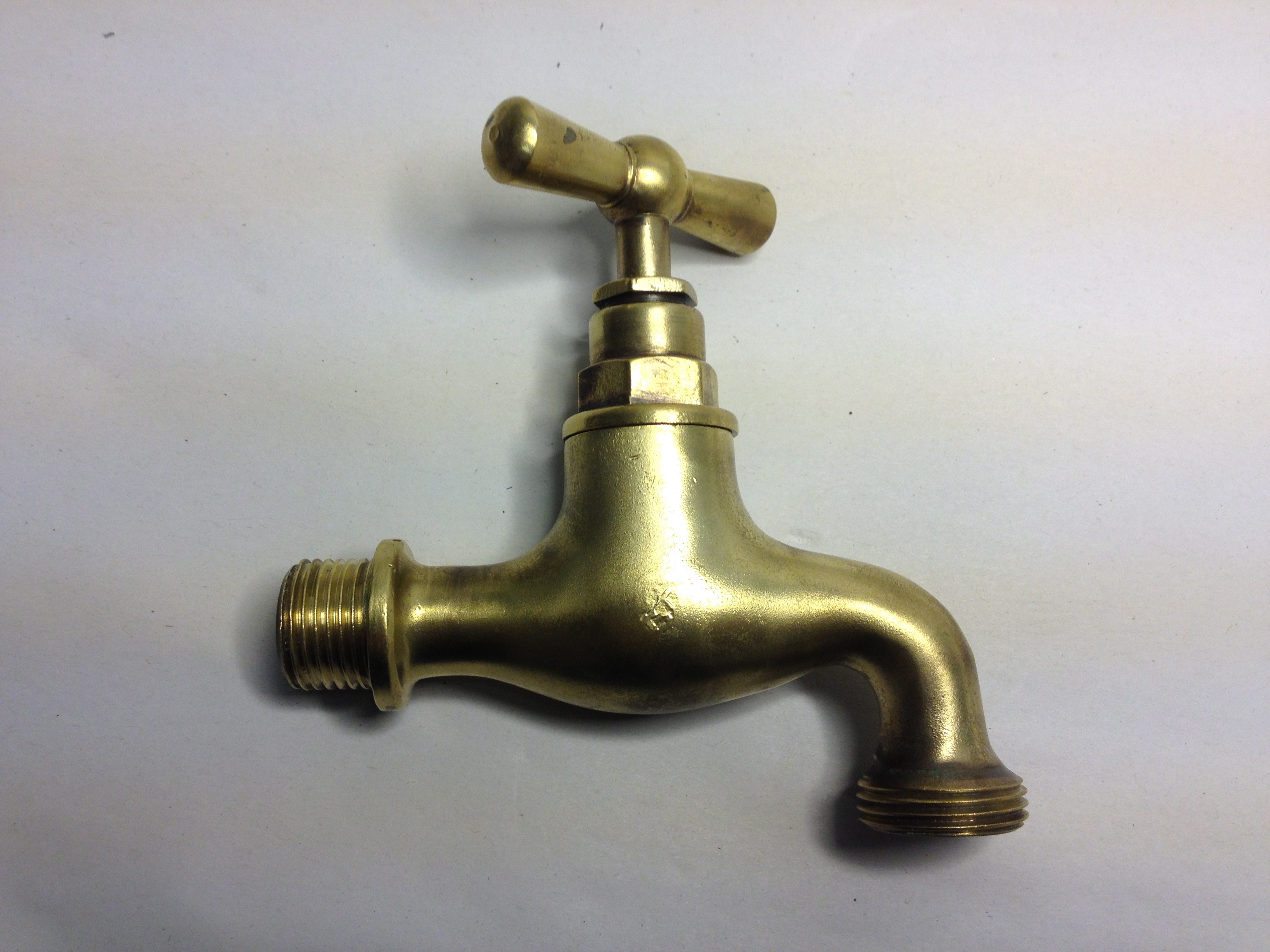 A “Burnished Brass” garden tap