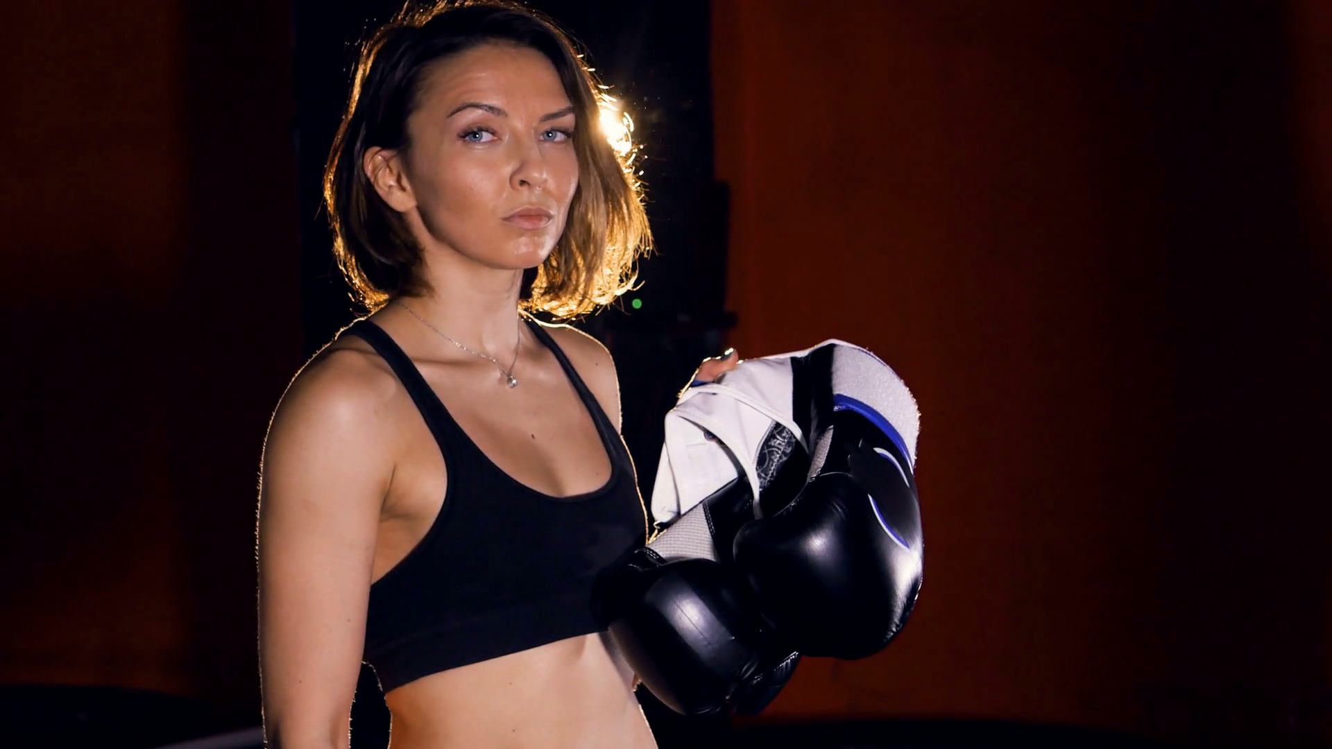 The portrait of the girl boxer with boxing gloves. 4K Stock Video ...