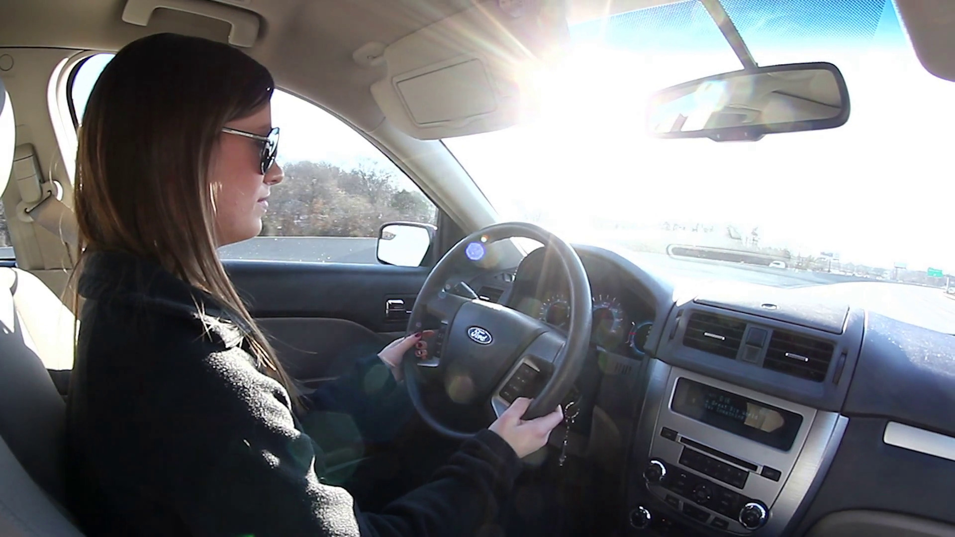 Teen girl driving car with sun flares Stock Video Footage - Videoblocks