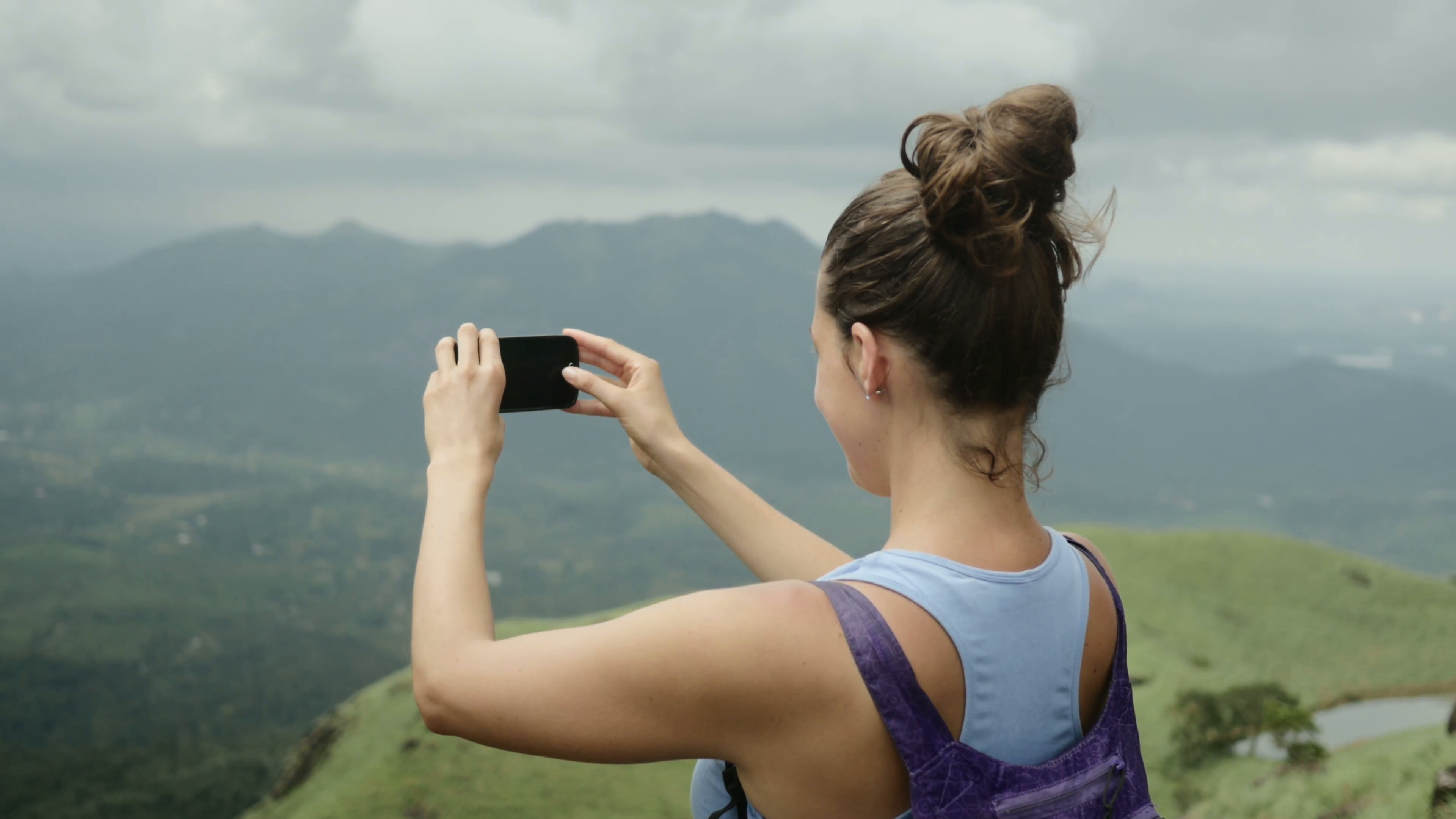 Attractive hiker girl from behind taking smartphone phone Stock ...