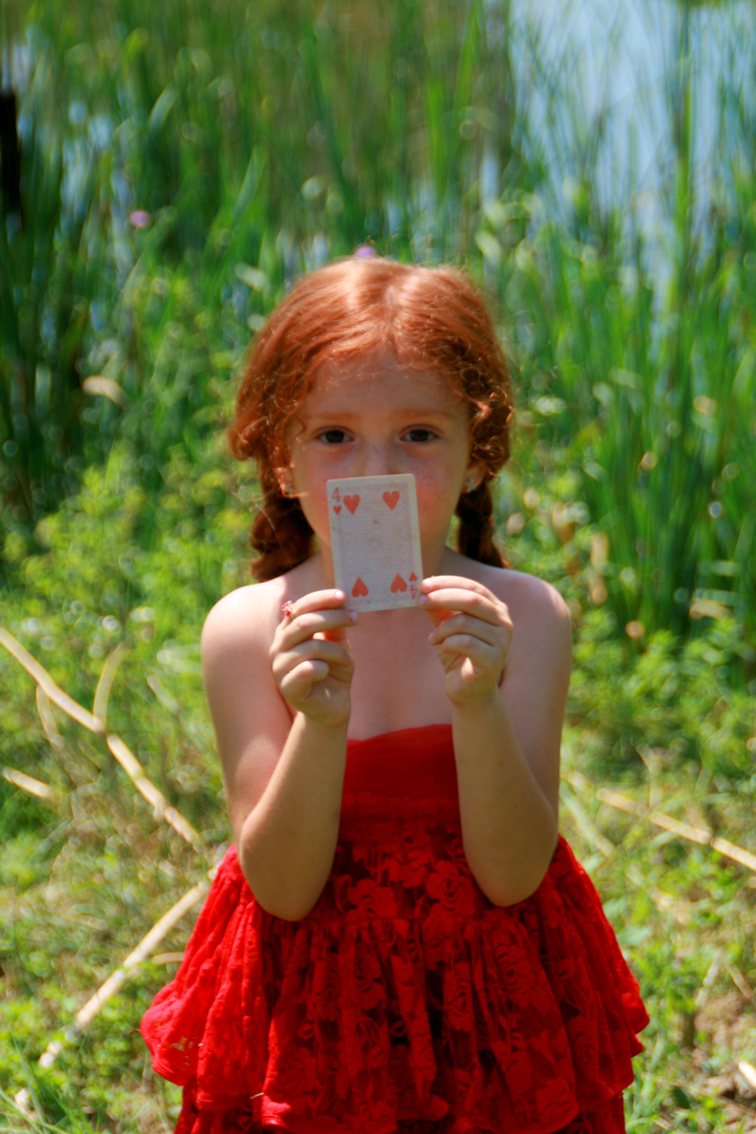 Girl holding a card photo