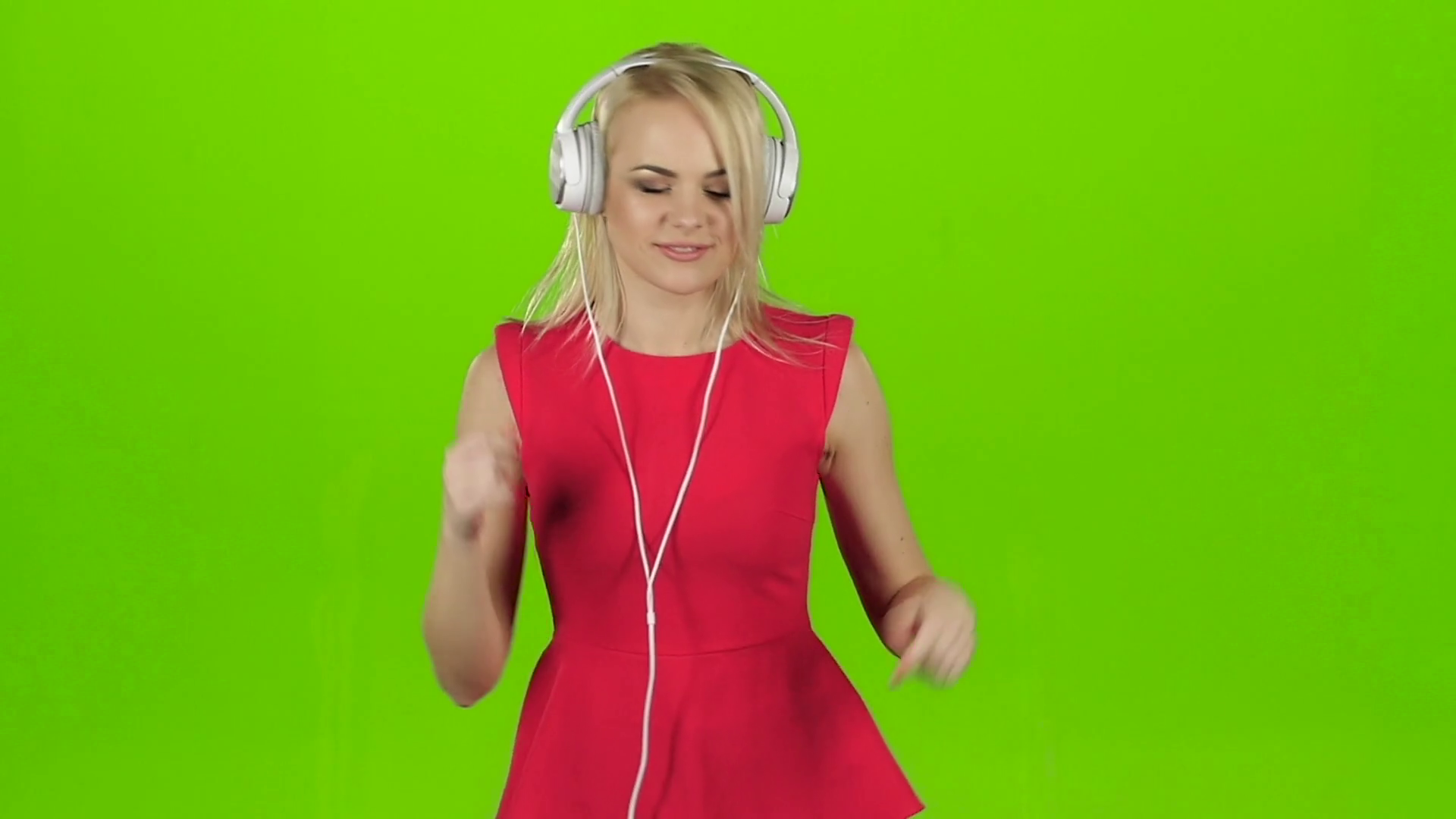 Sexy girl in red dress dancing in headphones, green screen Stock ...