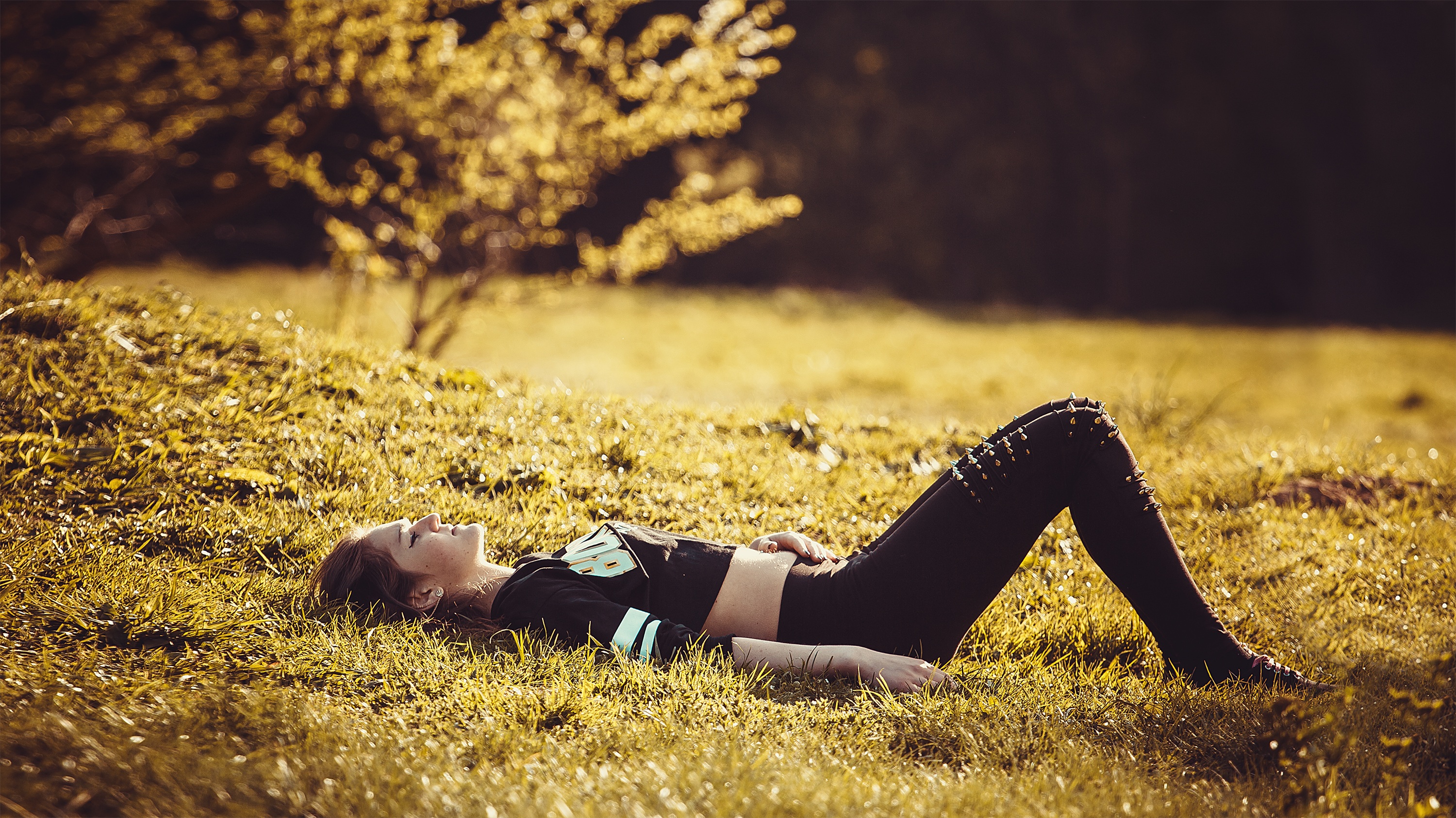 Girl lying on the grass photo