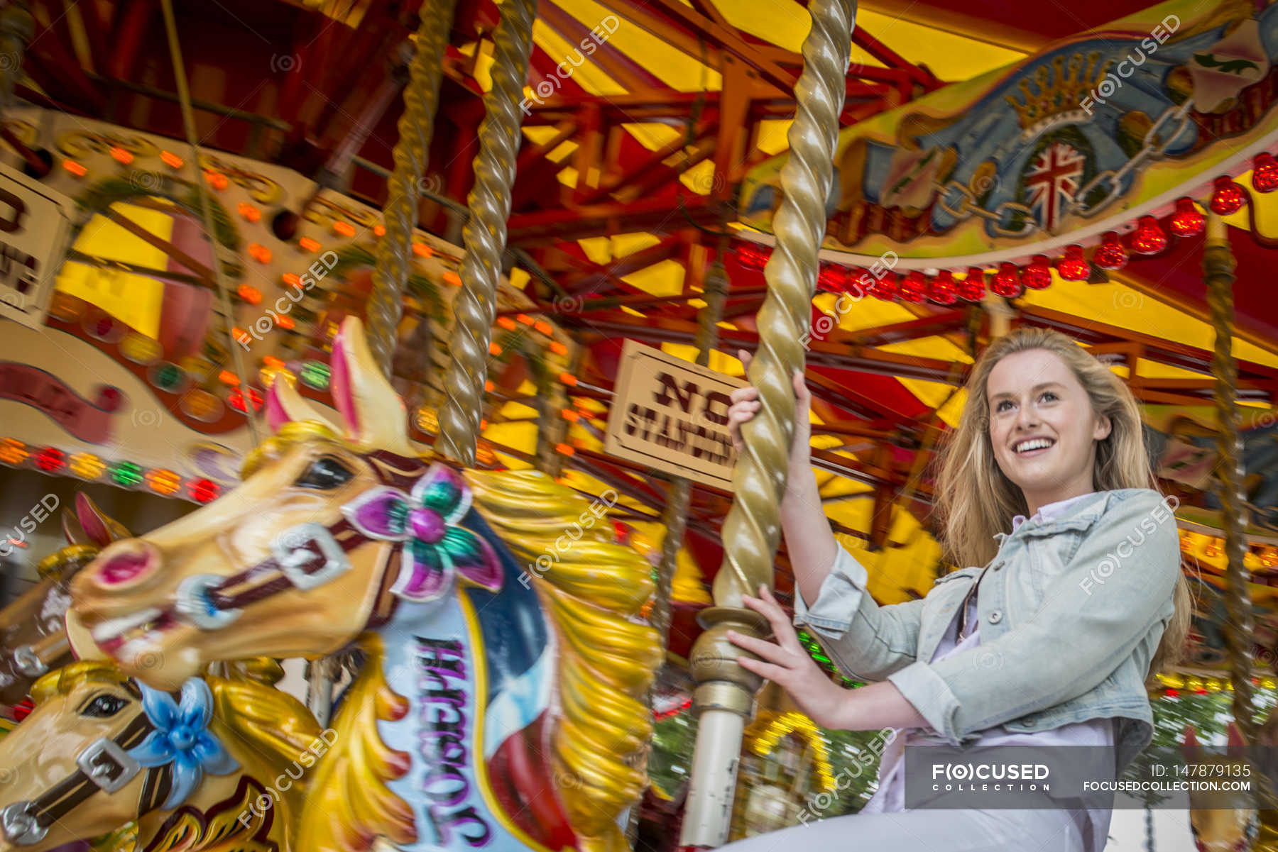 Girl riding carousel on South Bank — Stock Photo | #147879135
