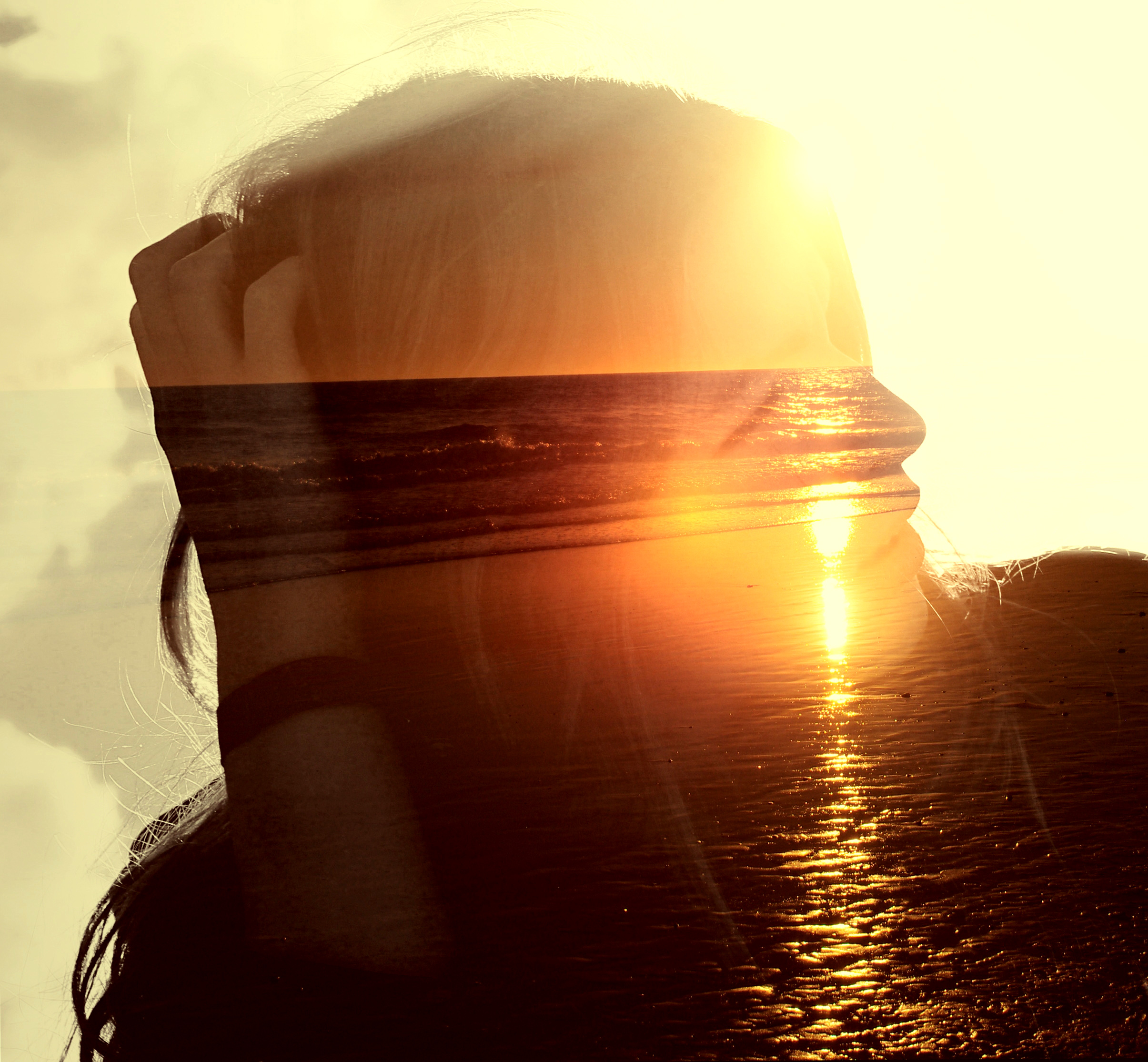 Girl on the beach at sunset - double exposure effect photo