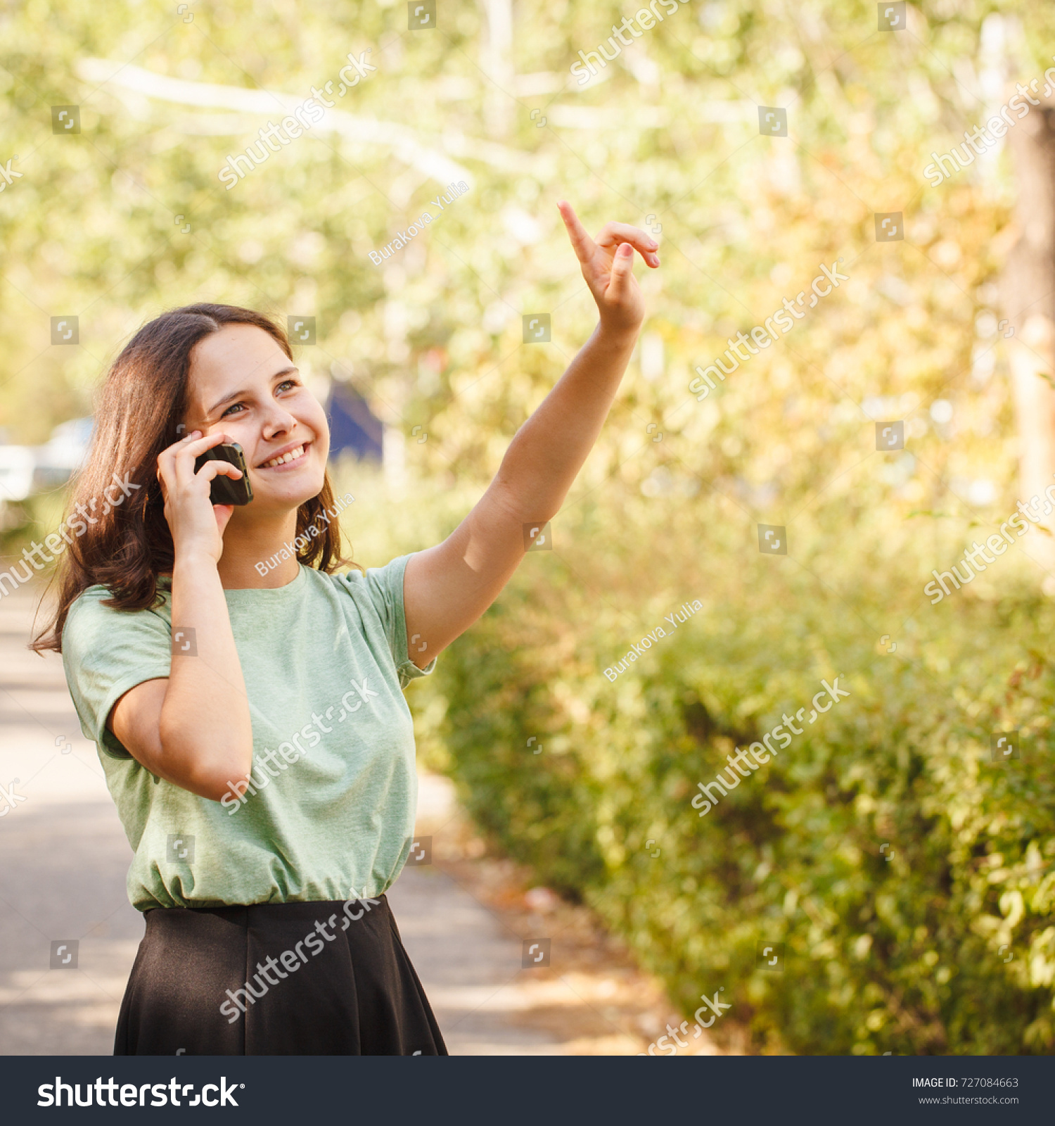 Young Teenage Girl Outdoors Talking On Stock Photo (Royalty Free ...
