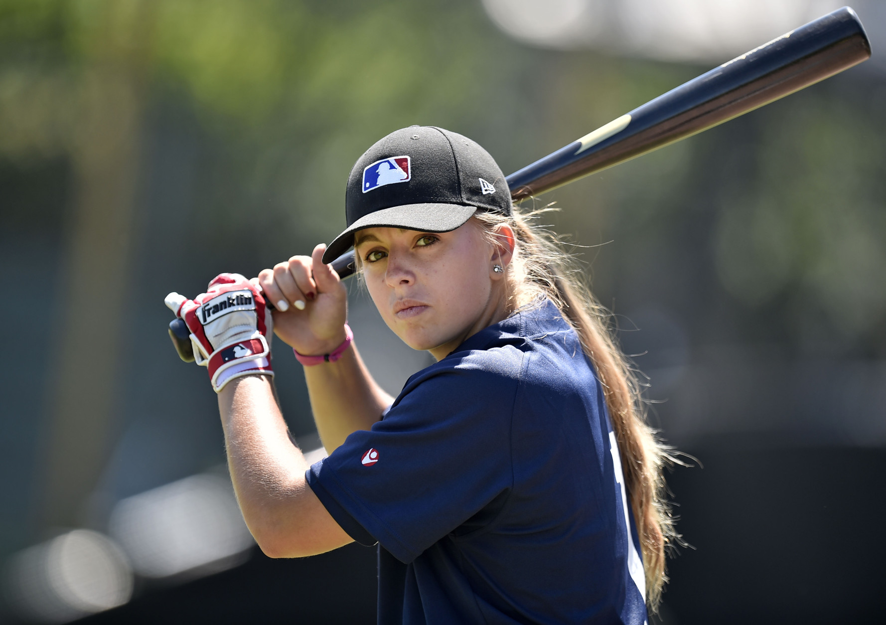 Girl playing baseball photo