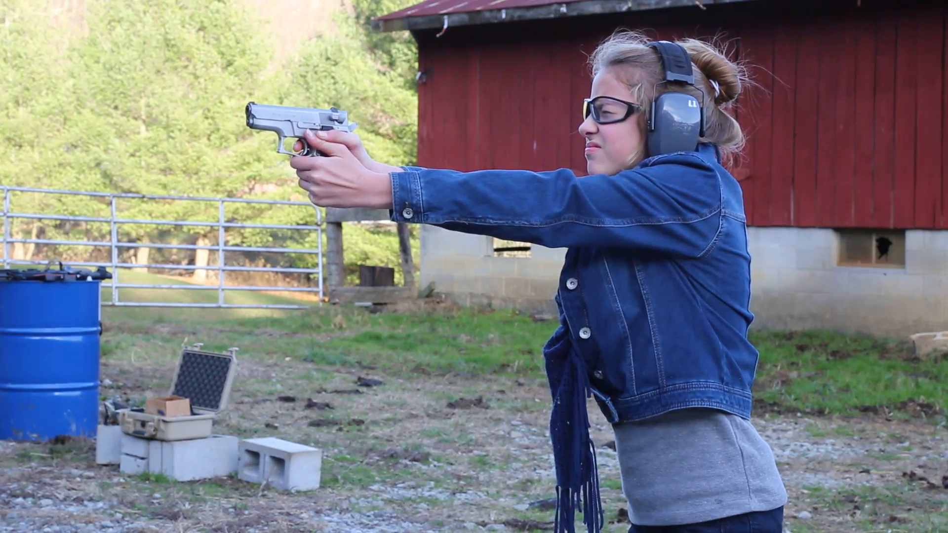 Young girl shooting a hand gun Stock Video Footage - Videoblocks