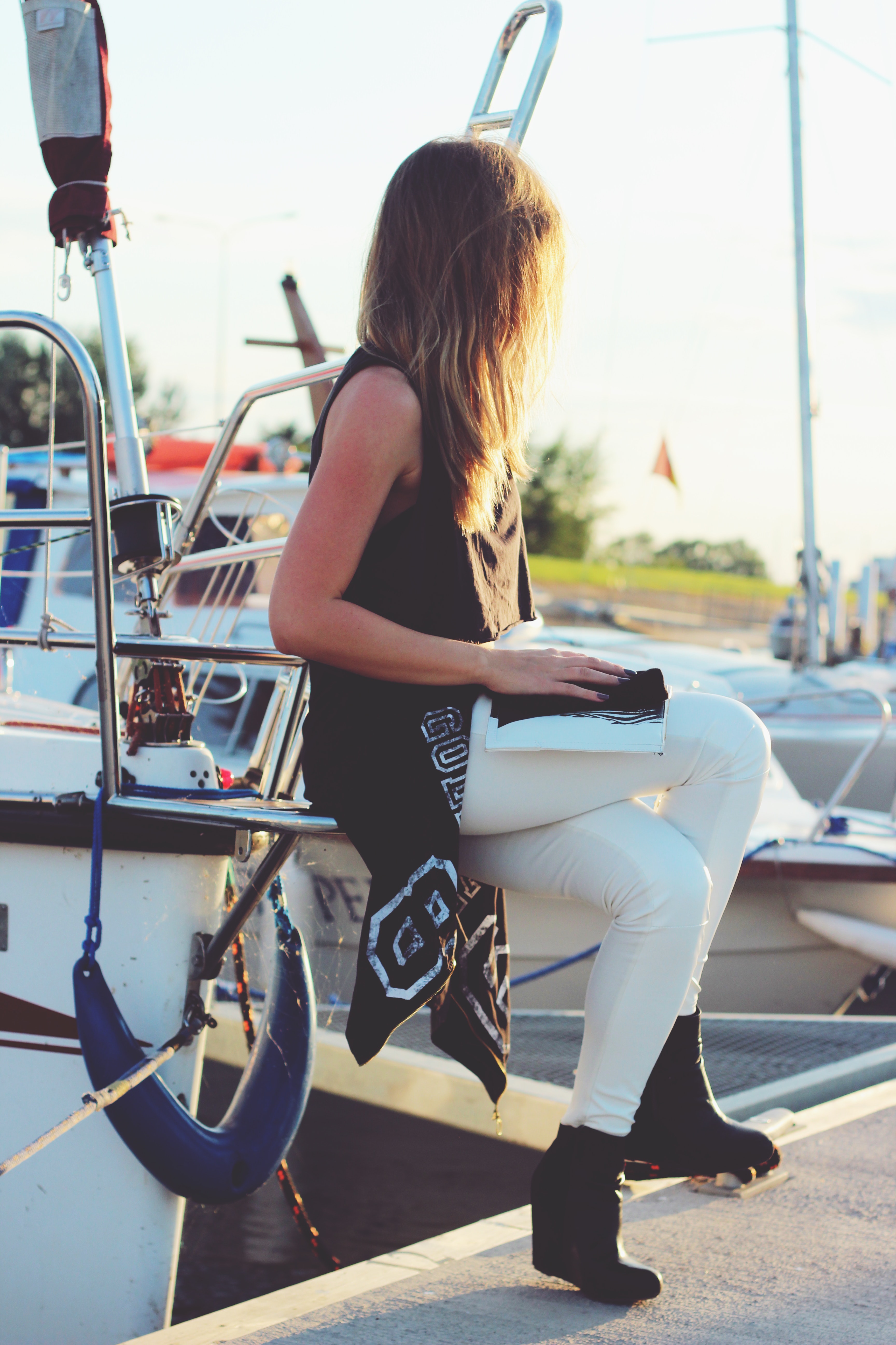 Girl sitting on the boat photo