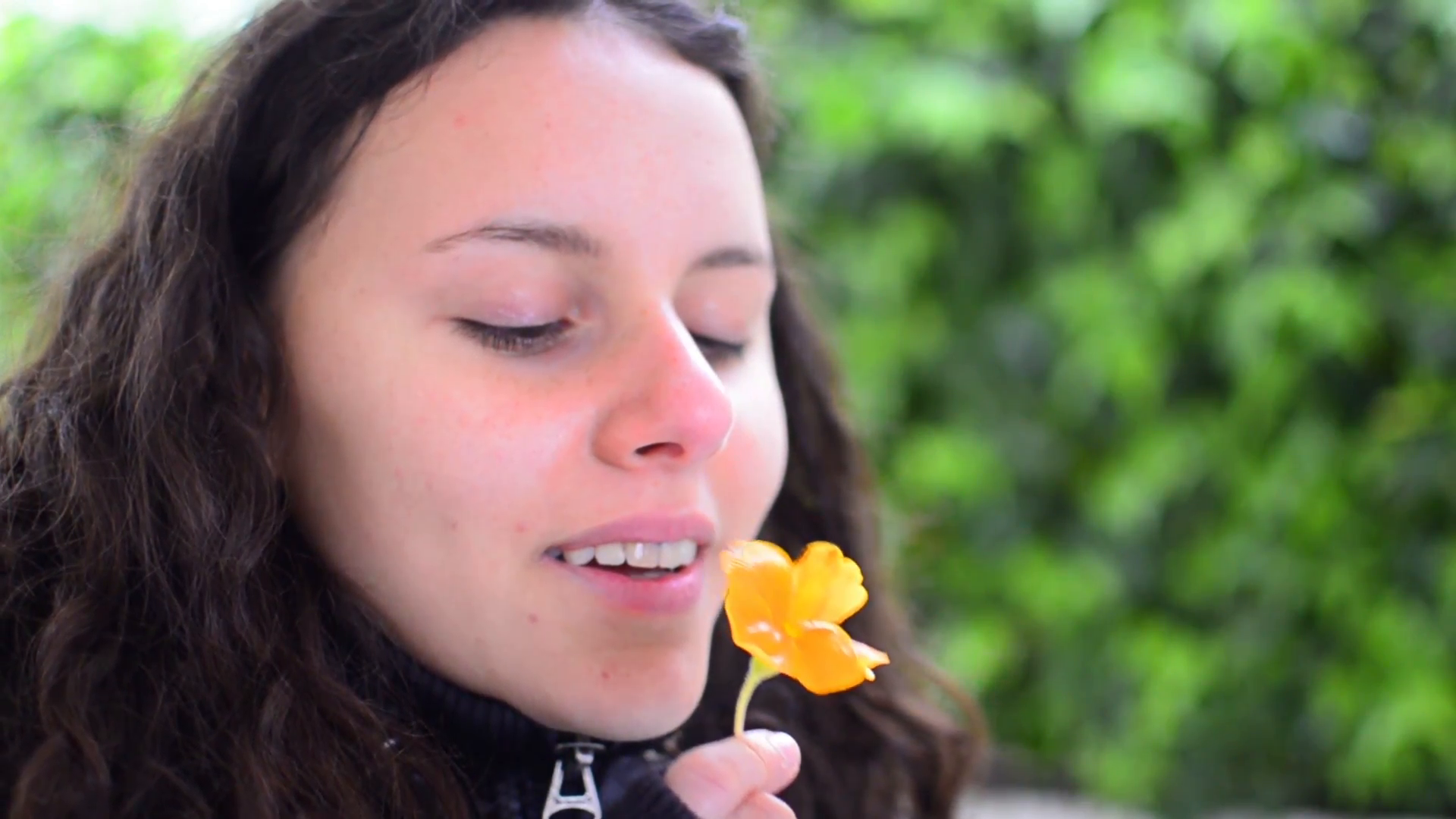 beautiful teen girl smelling yellow flower in Stock Video Footage ...