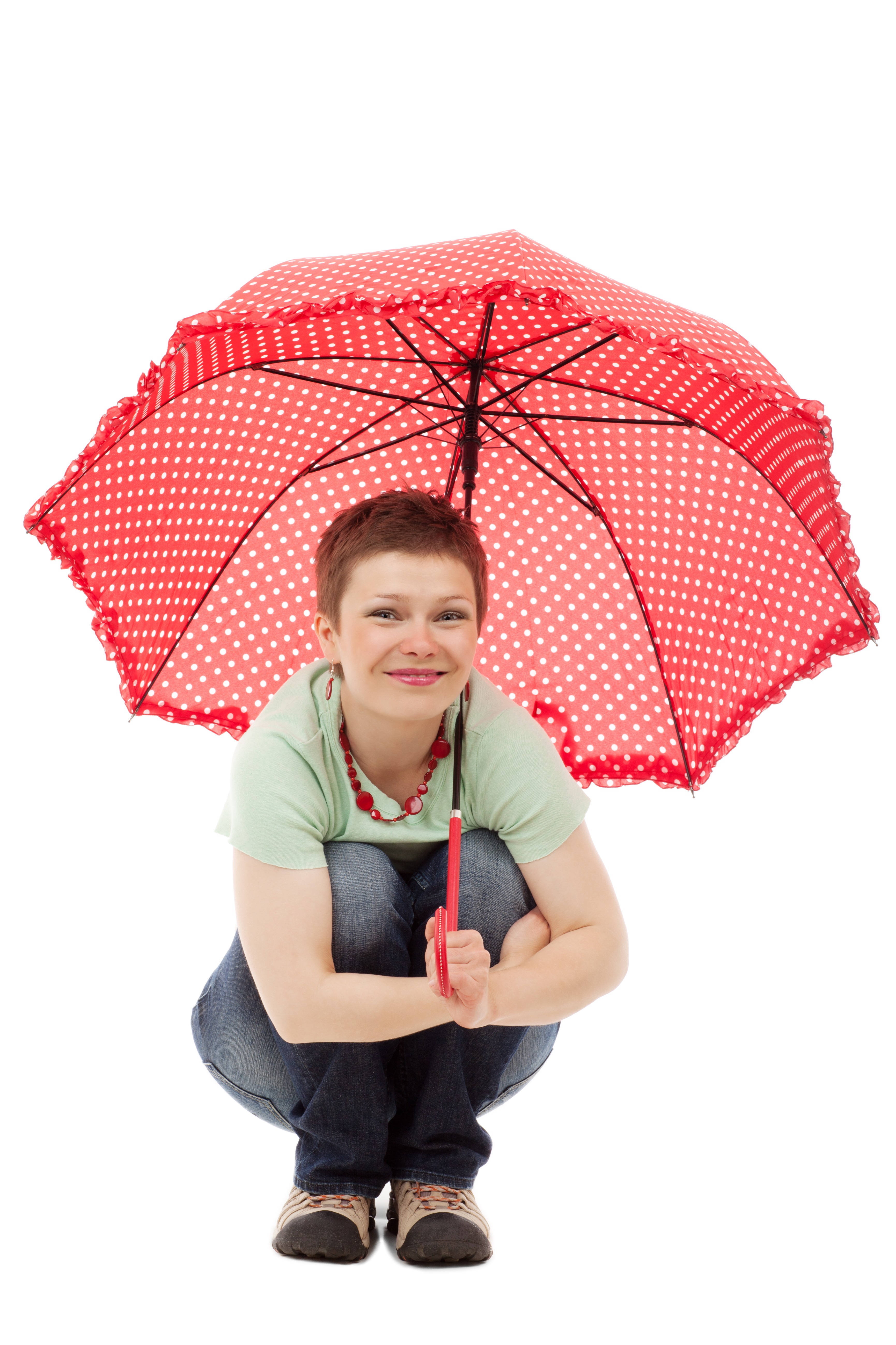 Girl squatting with umbrella photo