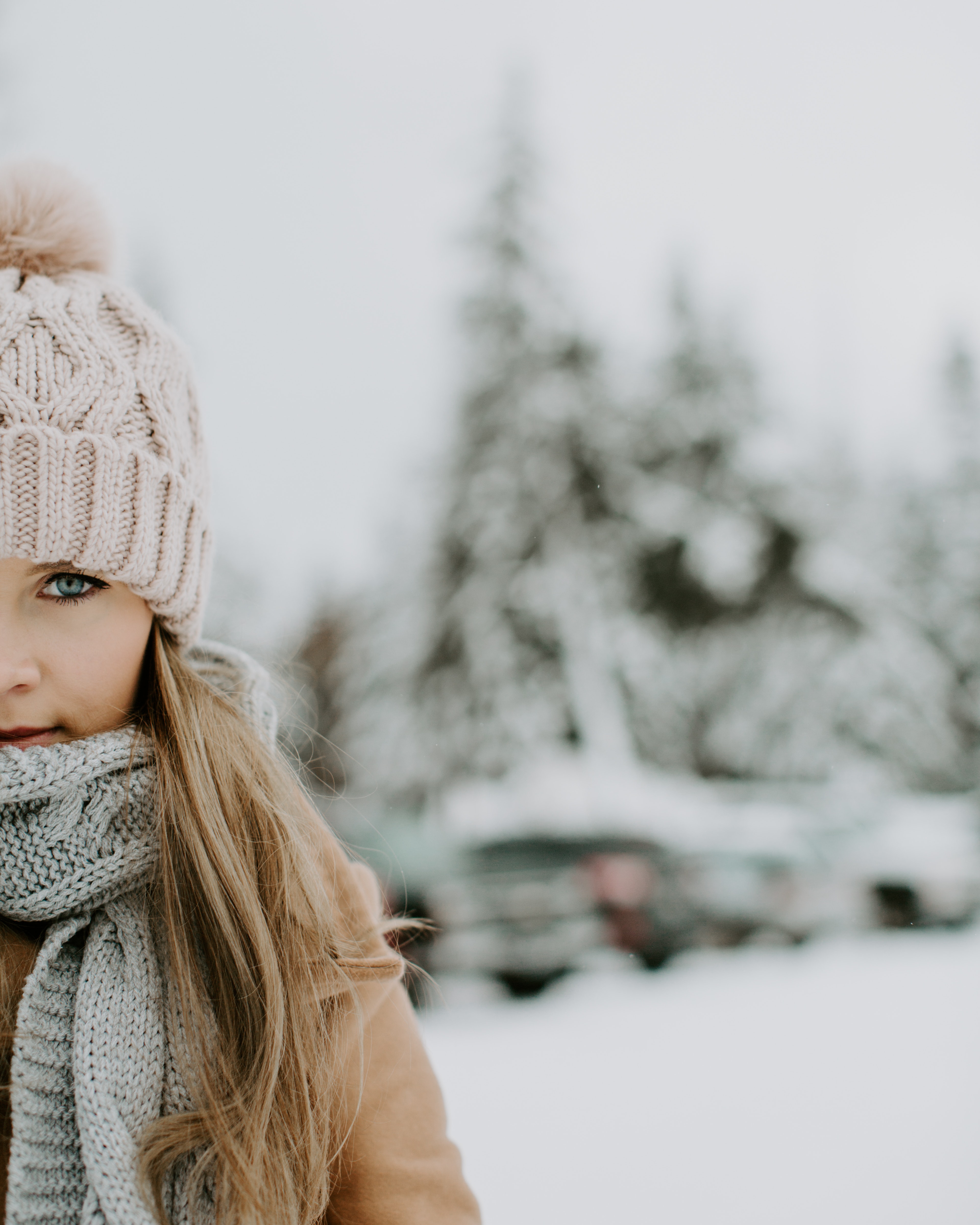 Girl wearing winter outfit on snowy field photo