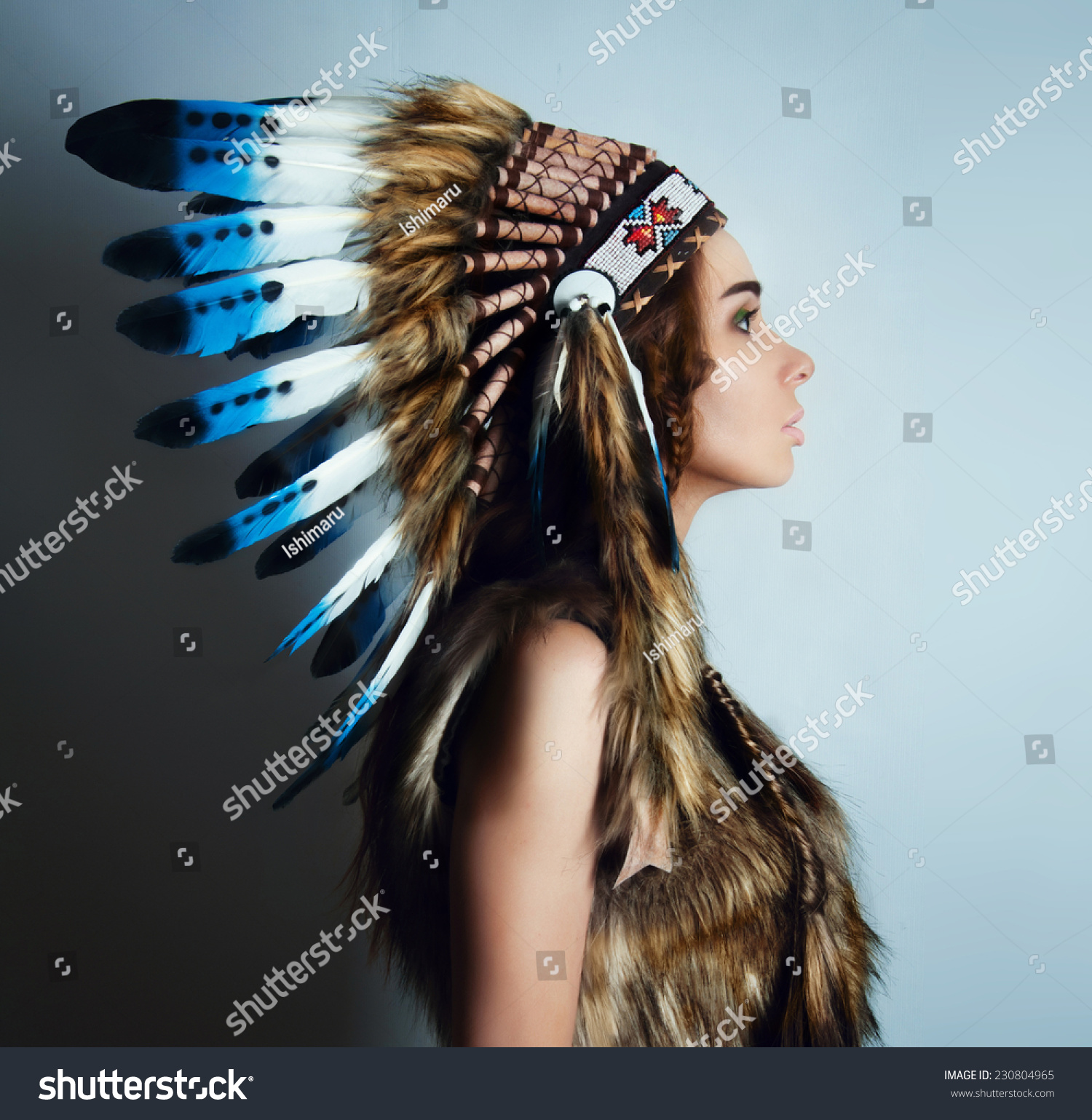 Royalty-free American Indian girl in a headdress of… #230804965 ...