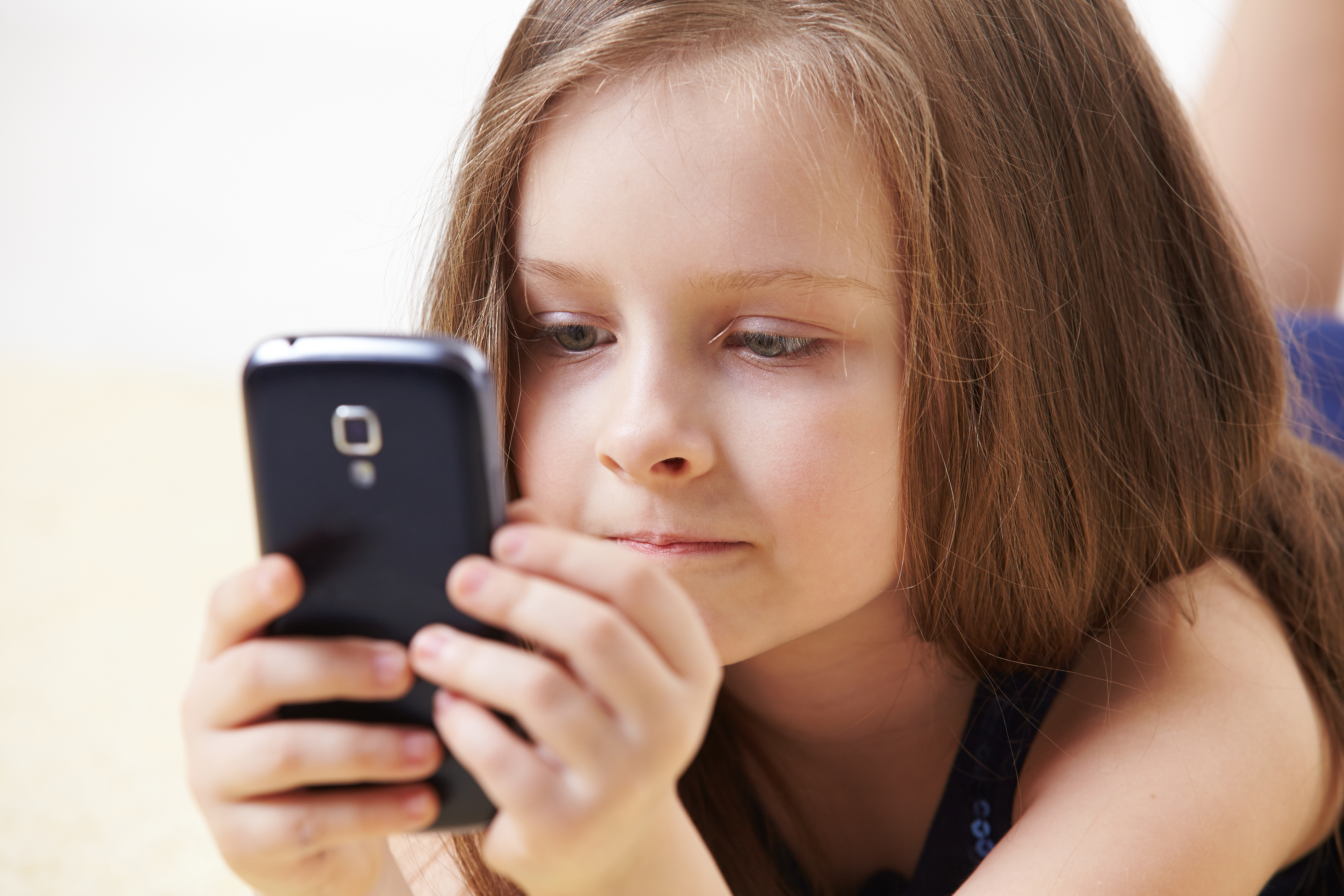 little girl with mobile phone | Vancouver Sun