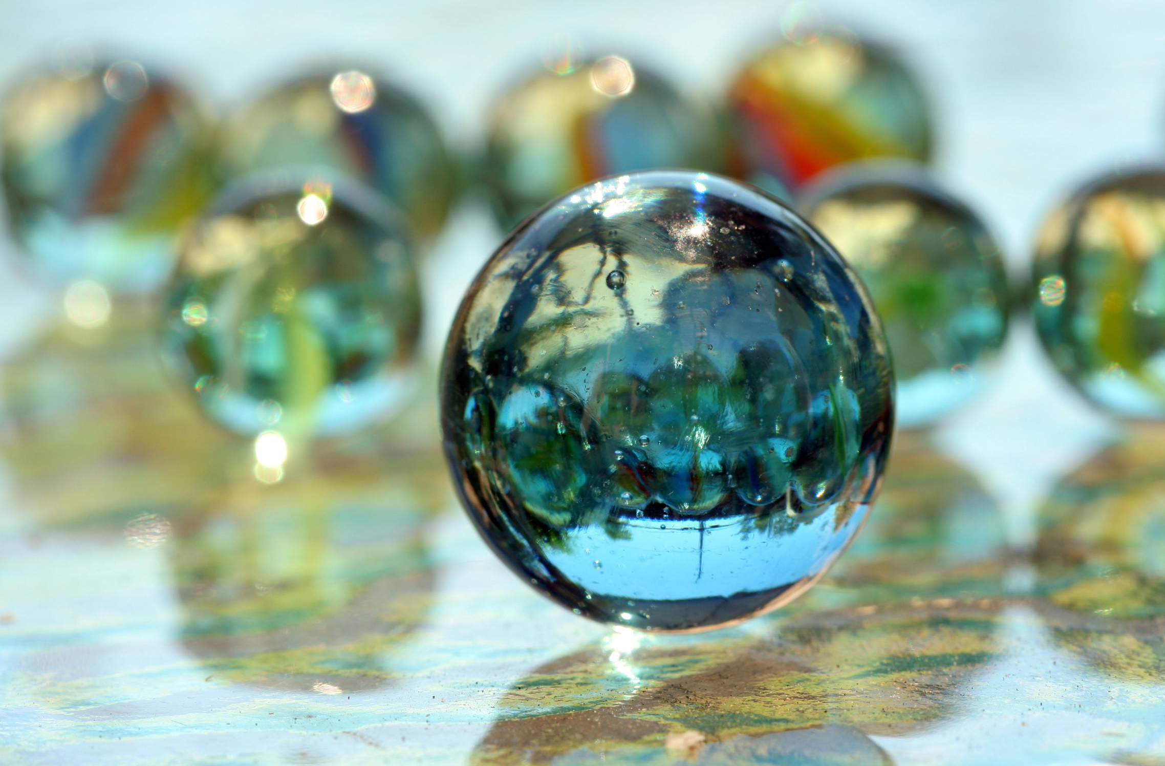 Why a Glass Ball Bounces Higher Than a Rubber Ball
