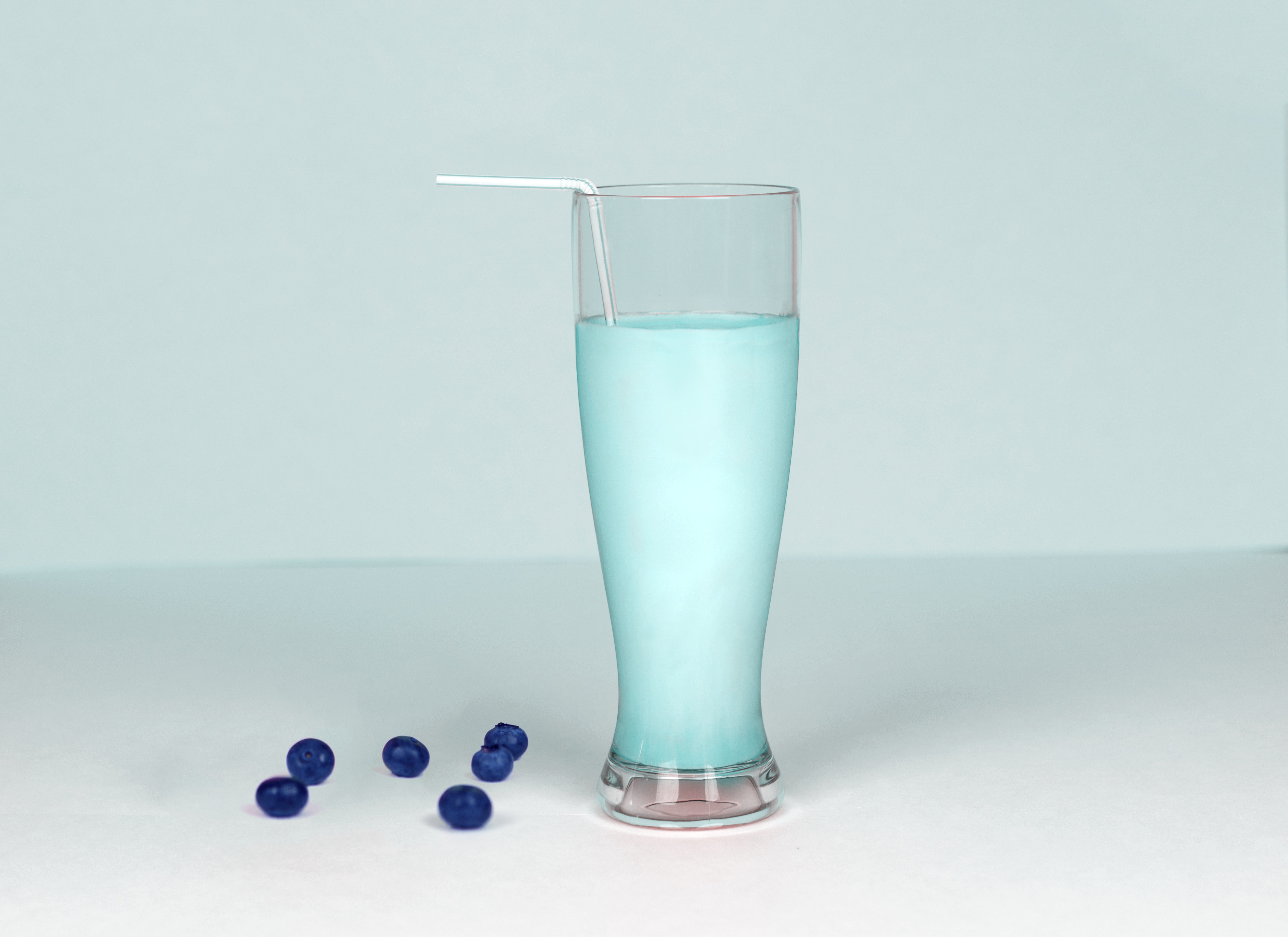 Glass of milk against white background photo
