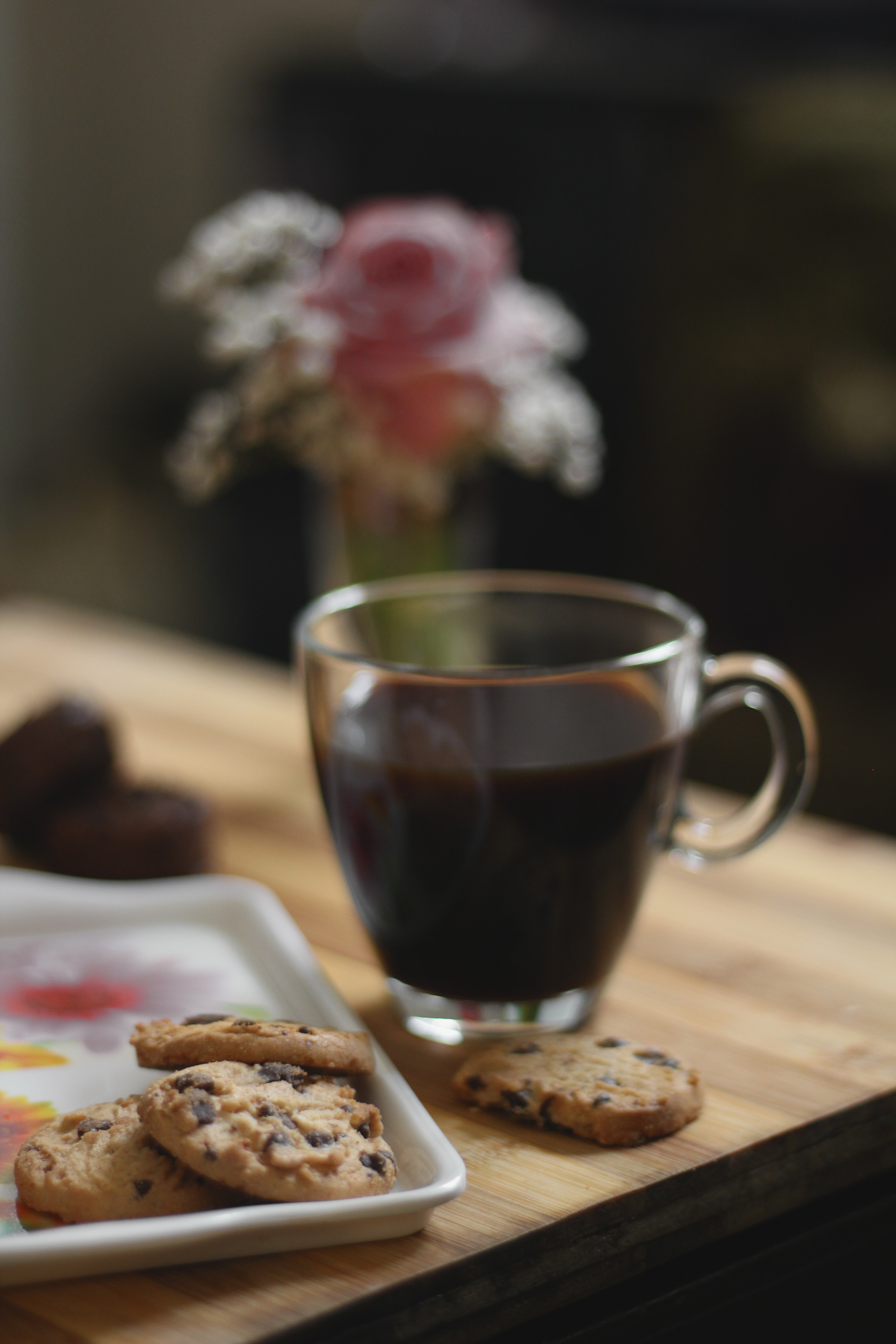 Glass Teacup Beside a Cookies on Tray Placed on Table, Black coffee, Blurred background, Breakfast, Close -up, HQ Photo