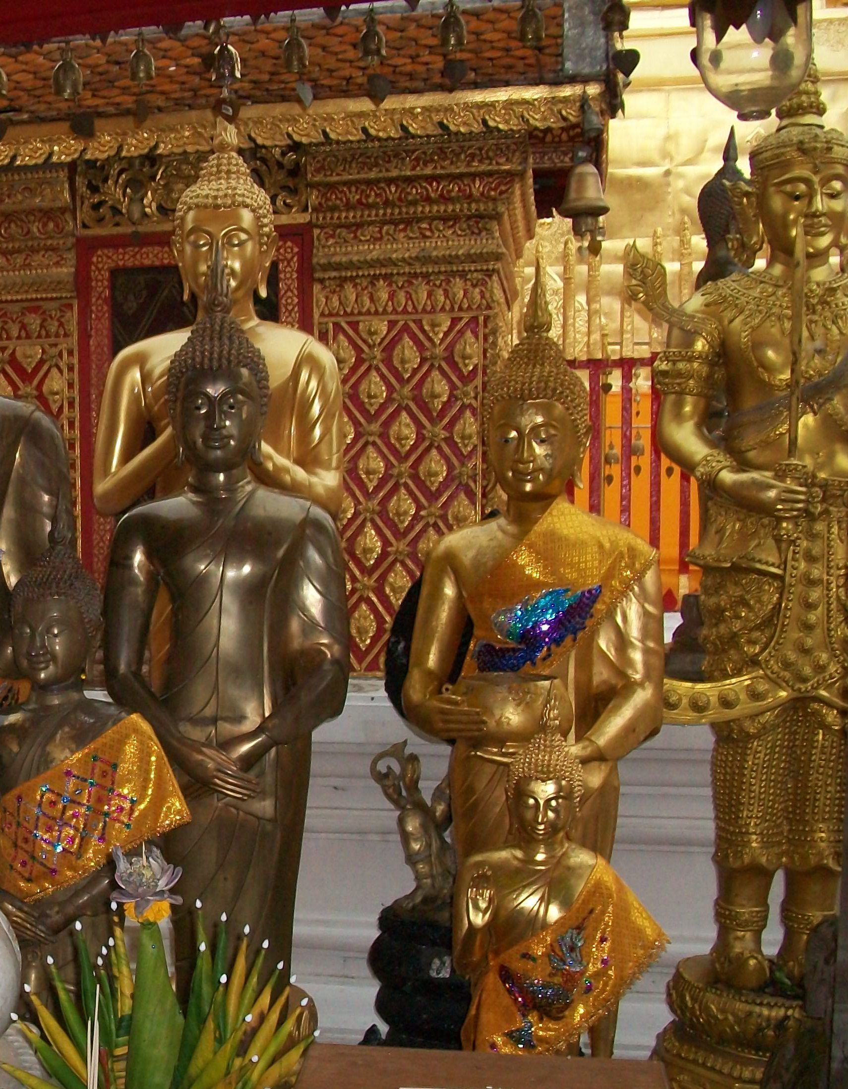 Gold and brass buddhist statues photo