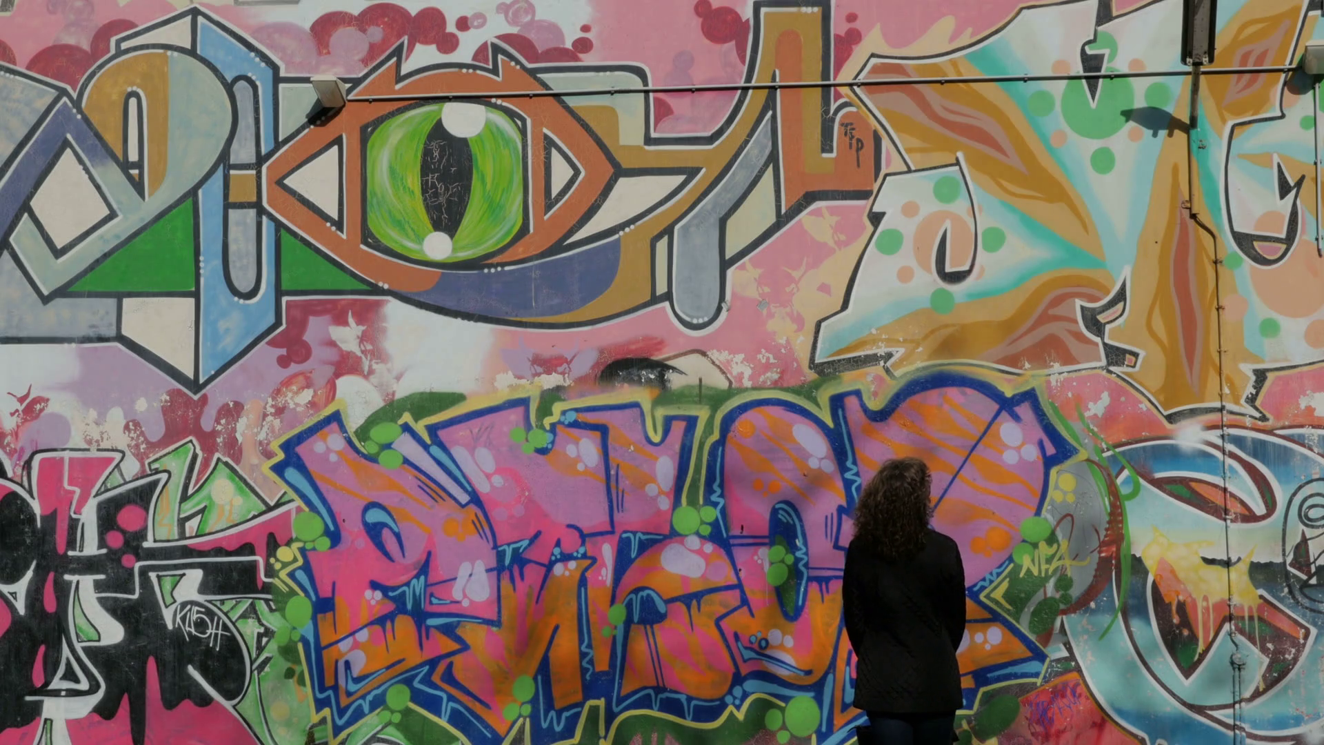 Girl looking at wall of Graffiti, Graffiti on Wall, Old Town ...