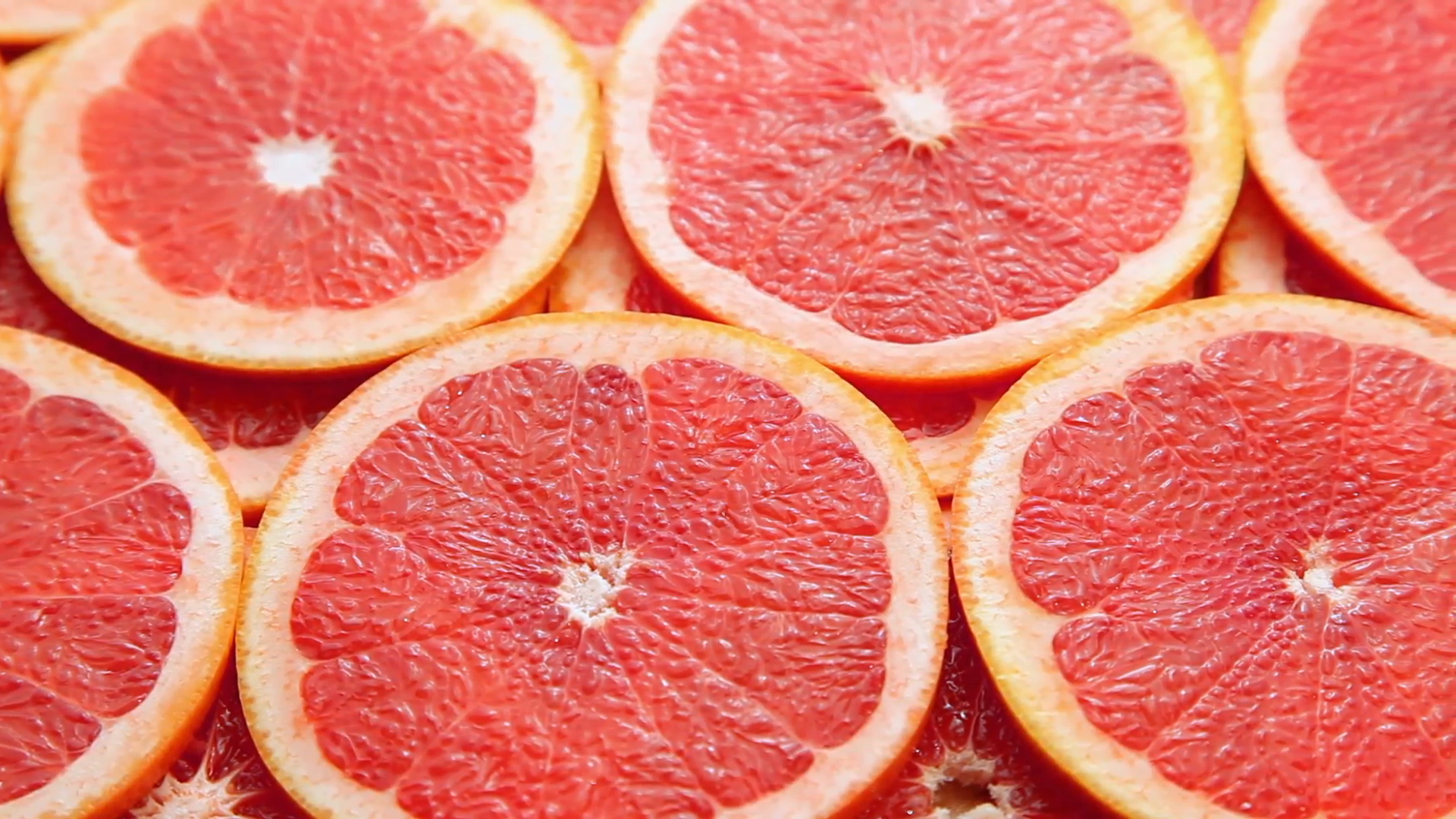 Sliced grapefruit, motion background Stock Video Footage - Videoblocks