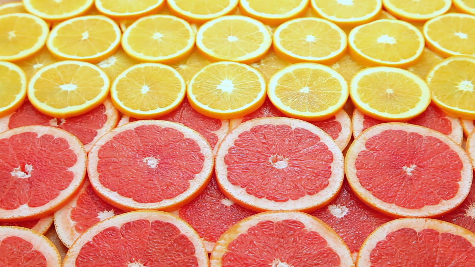 Red grapefruit with orange background Stock Video Footage - Videoblocks