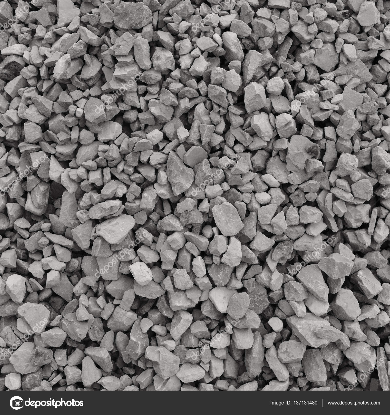 Abstract grey and beige gravel stone background, crushed gray stones ...