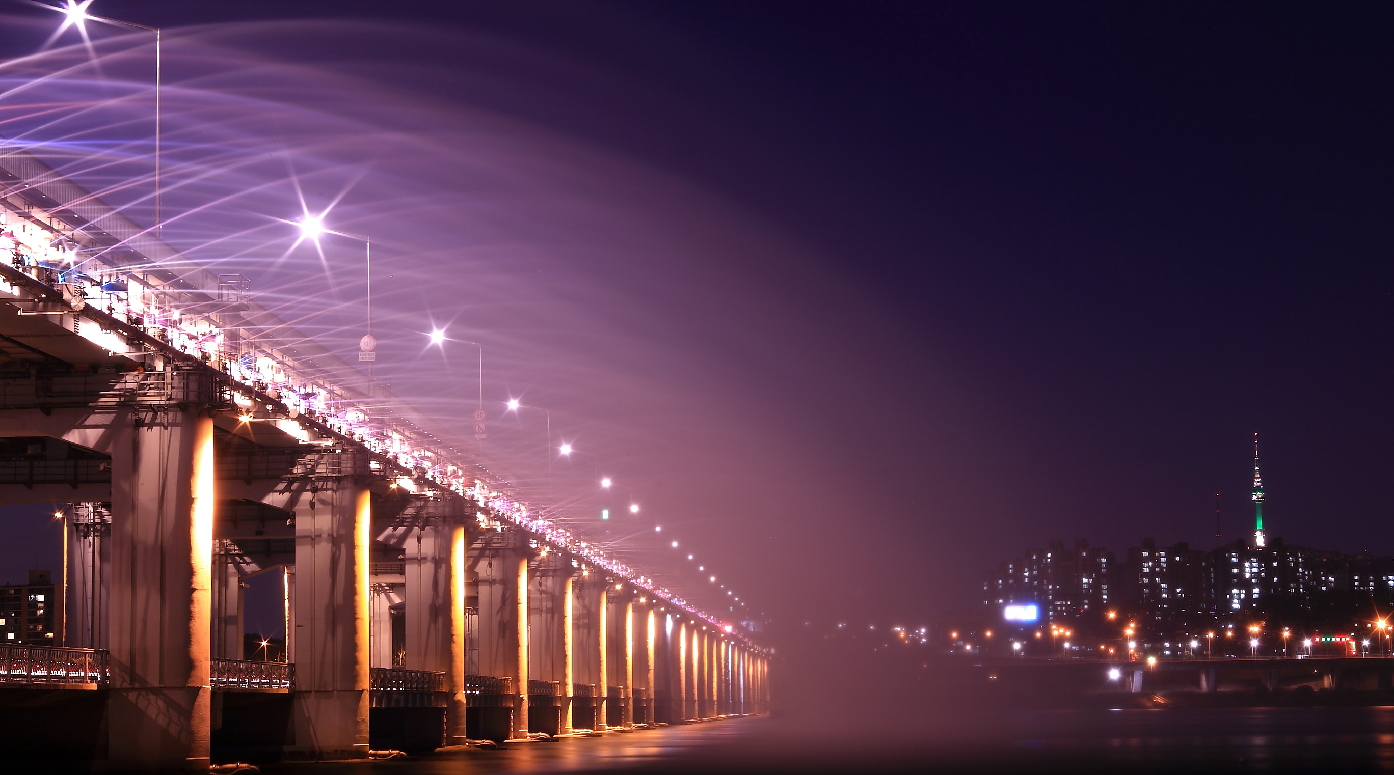 Gray bridge with street light during nighttime photo