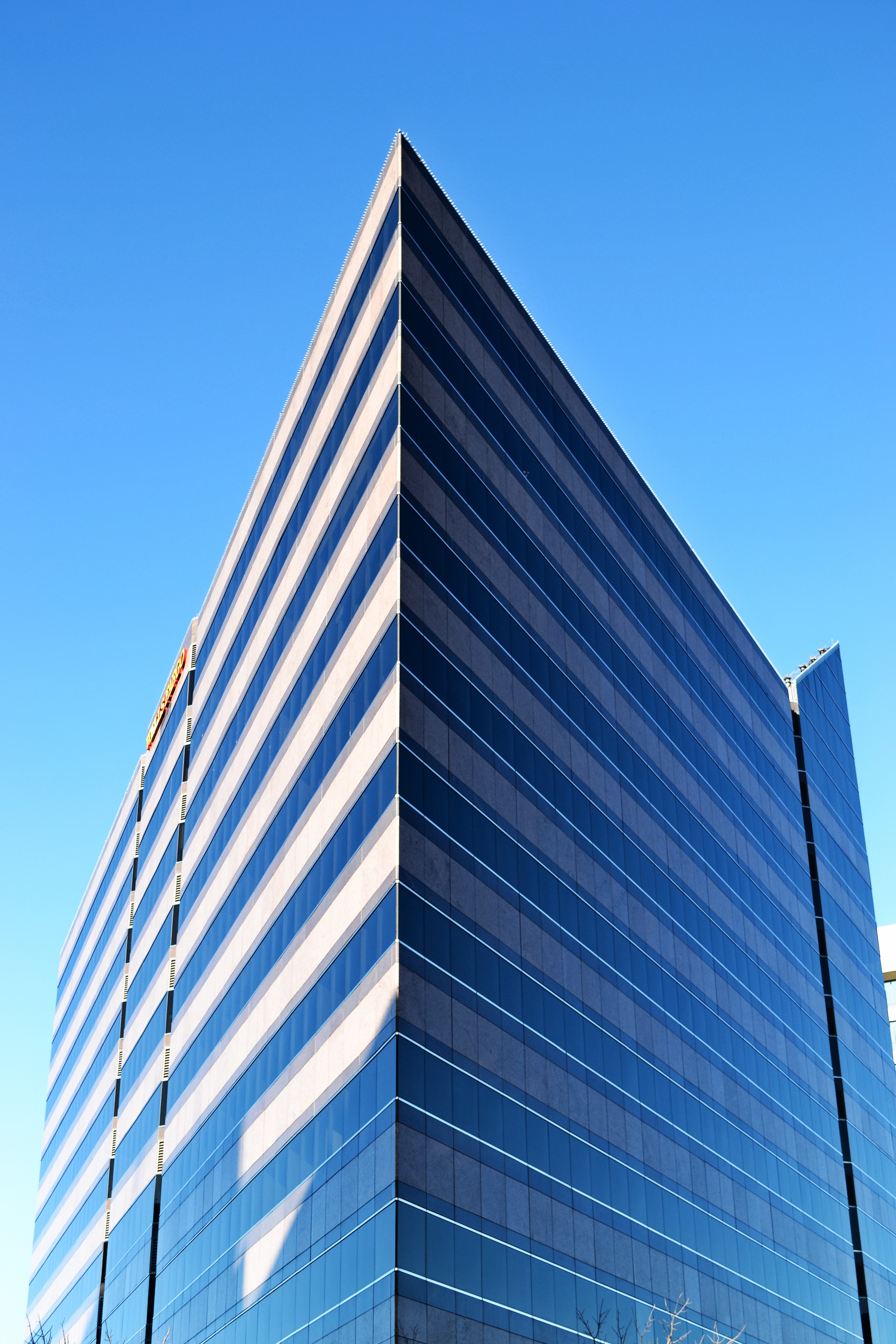Modern skyscraper on a background of blue sky photo